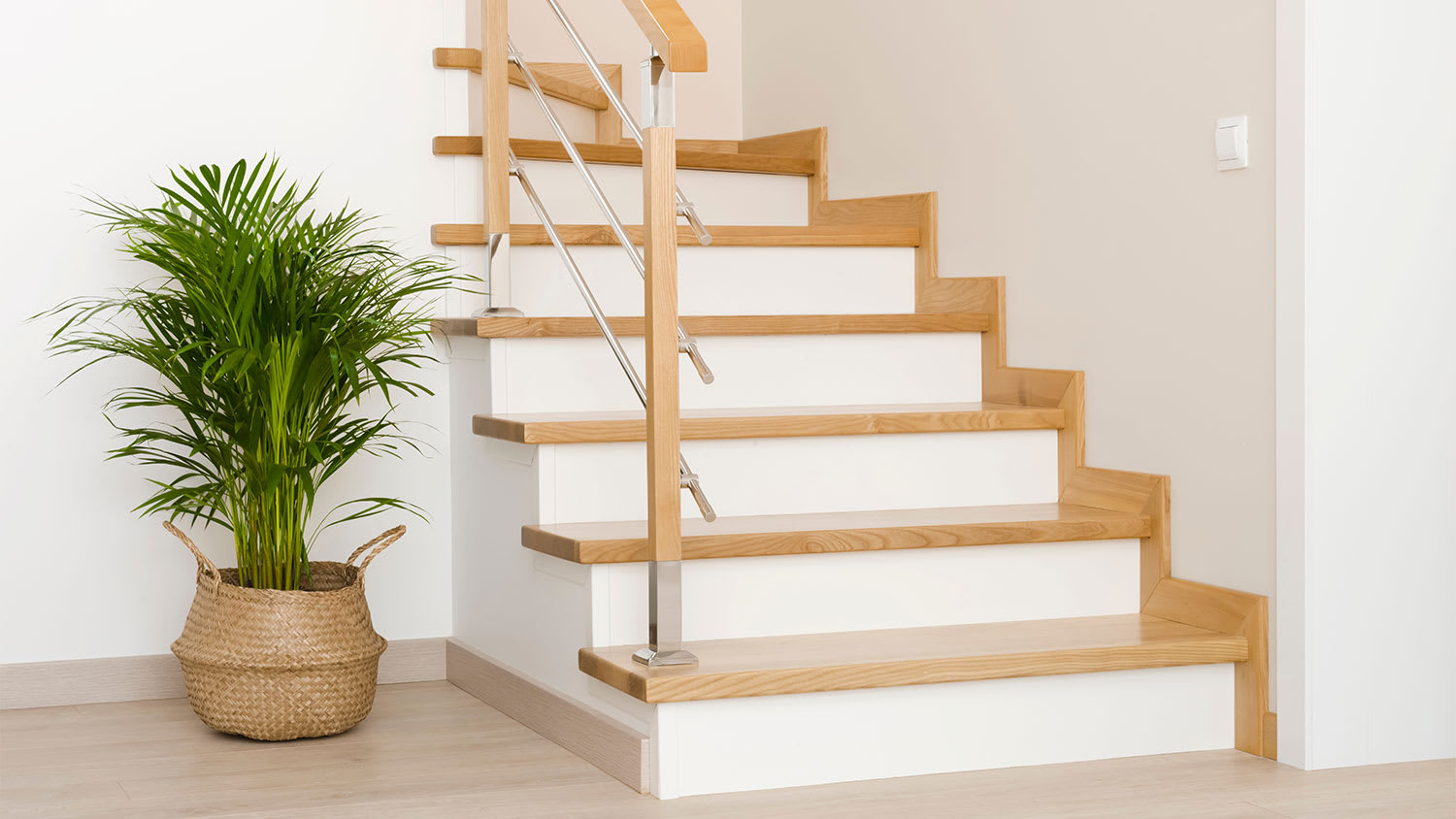 A view of stained wood trim on stairs