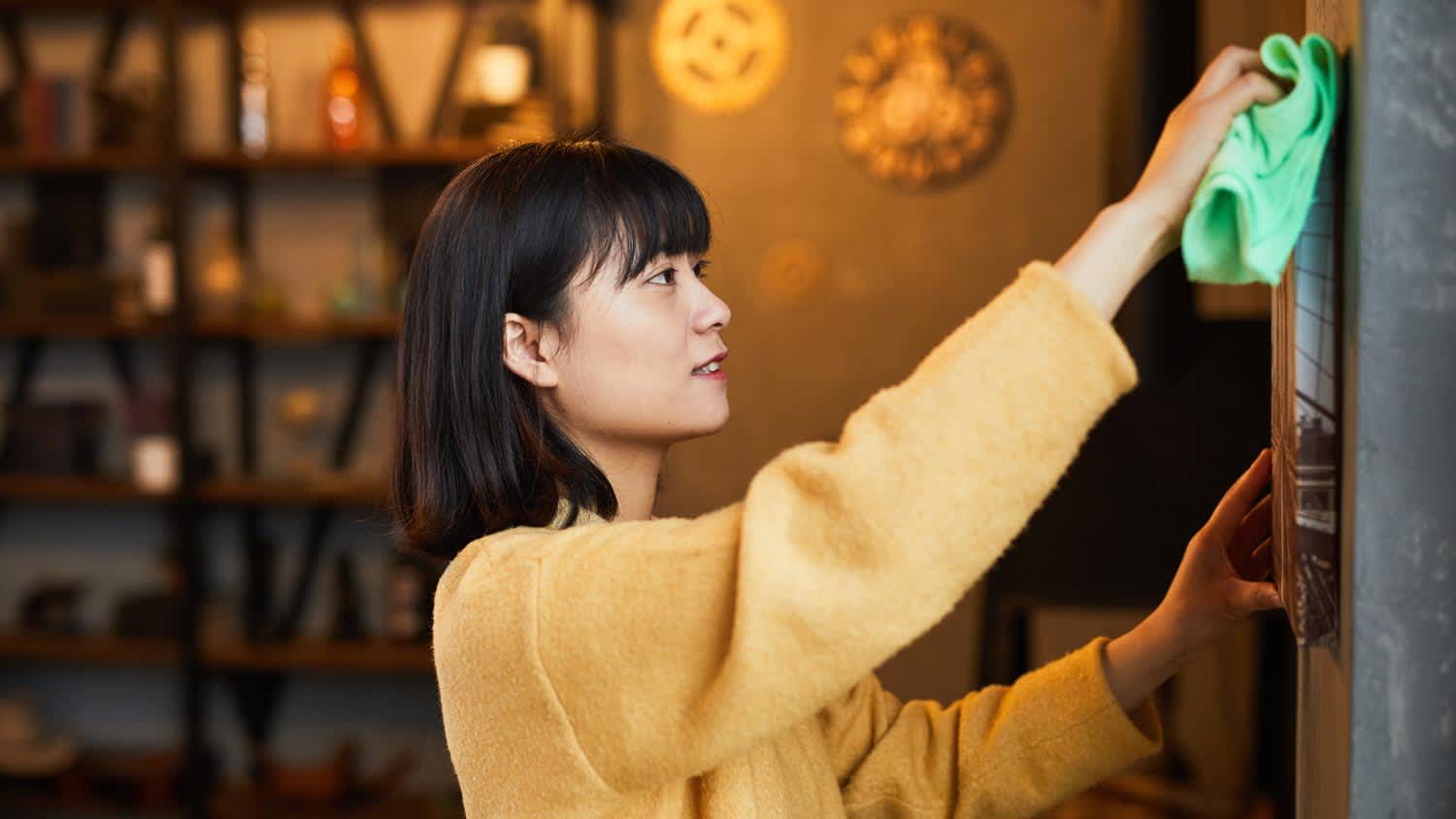 A woman cleaning her house