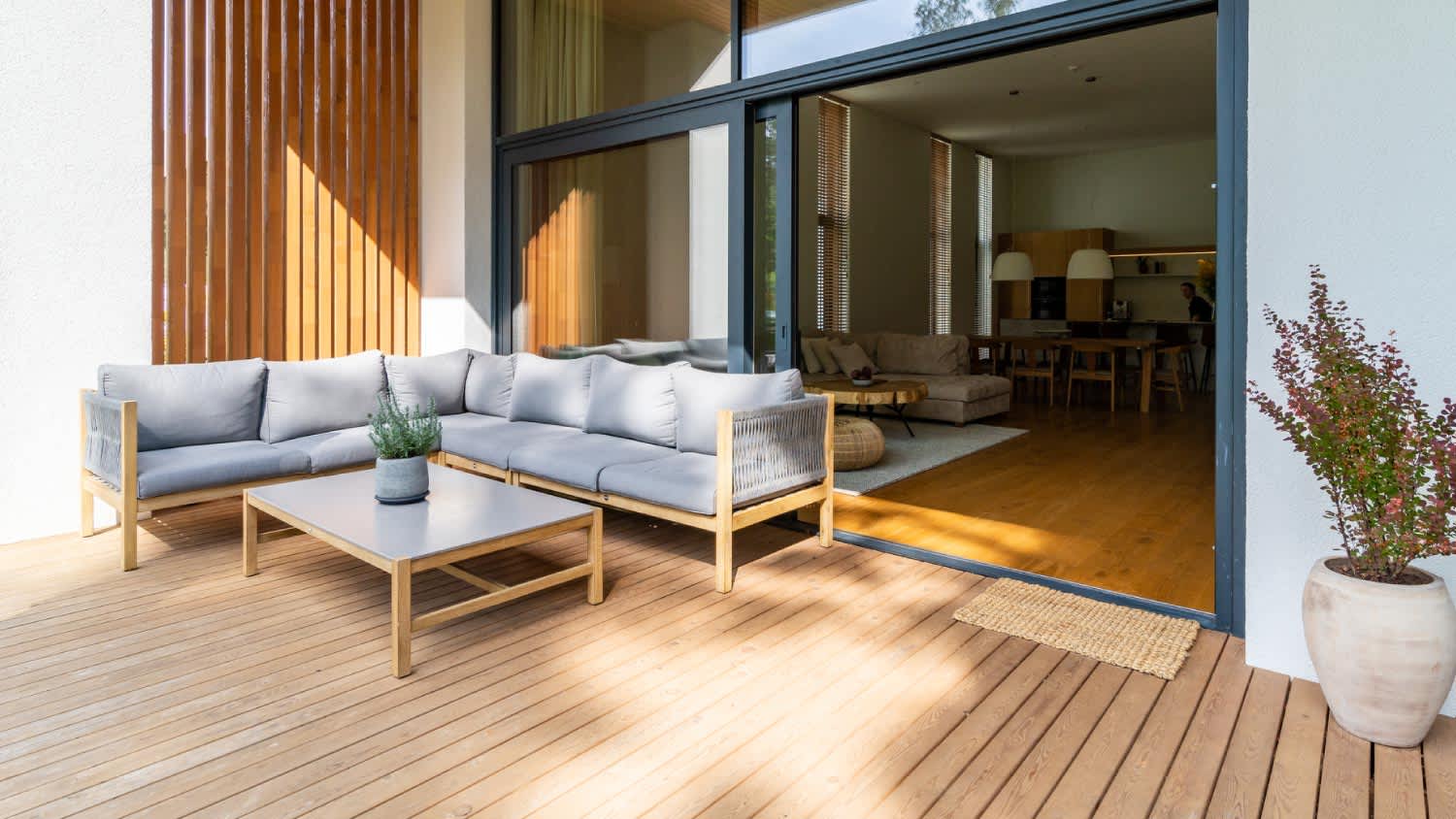 A wooden patio connected to a private building