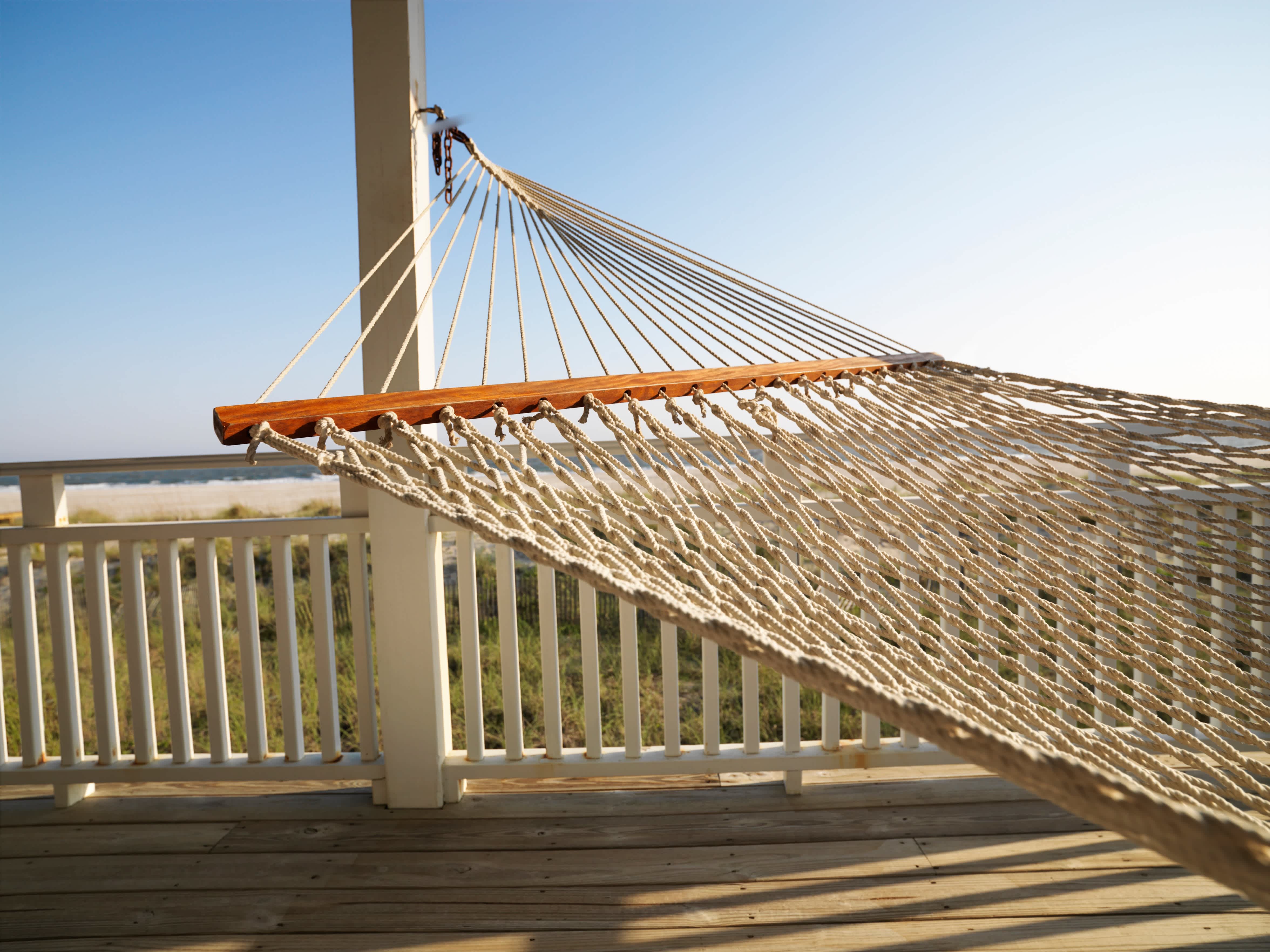 Hammock hanging from back porch