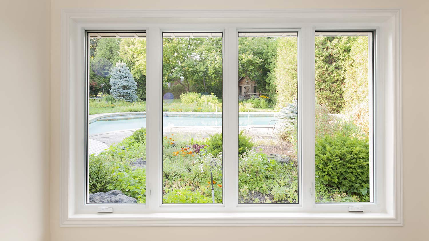 New crank windows with view of backyard