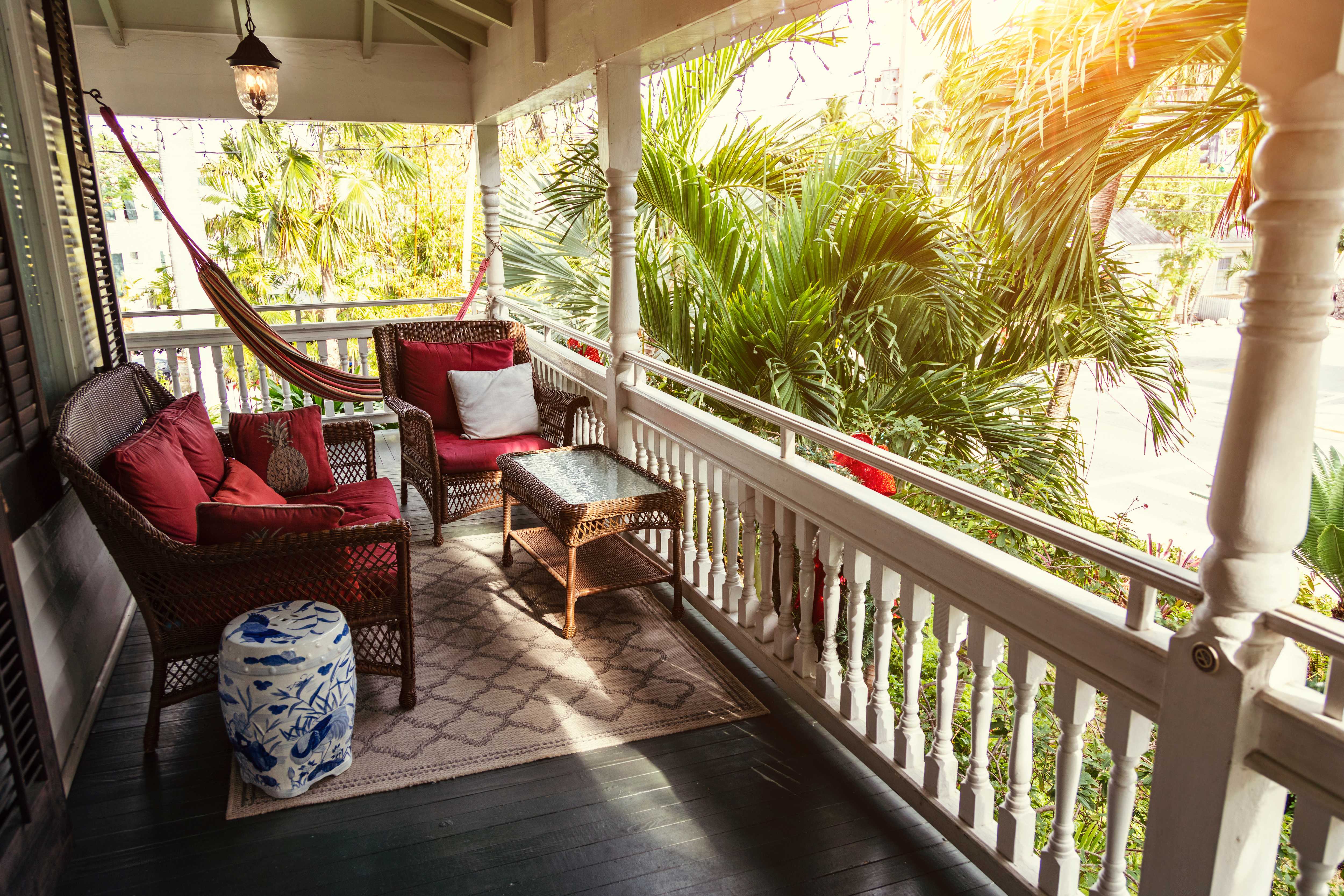 Conversation set on small balcony with outdoor rug