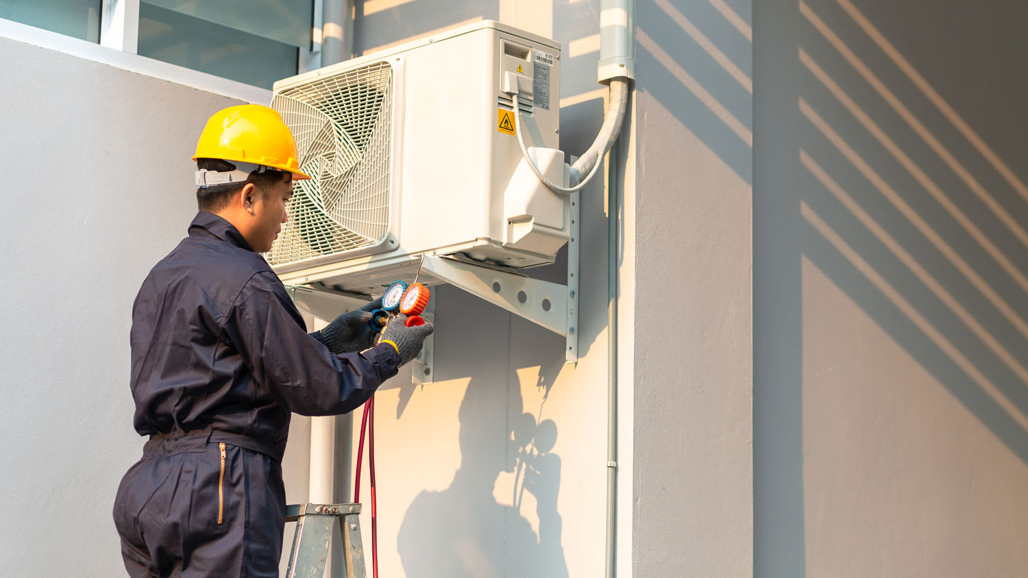 A technician checking an AC system
