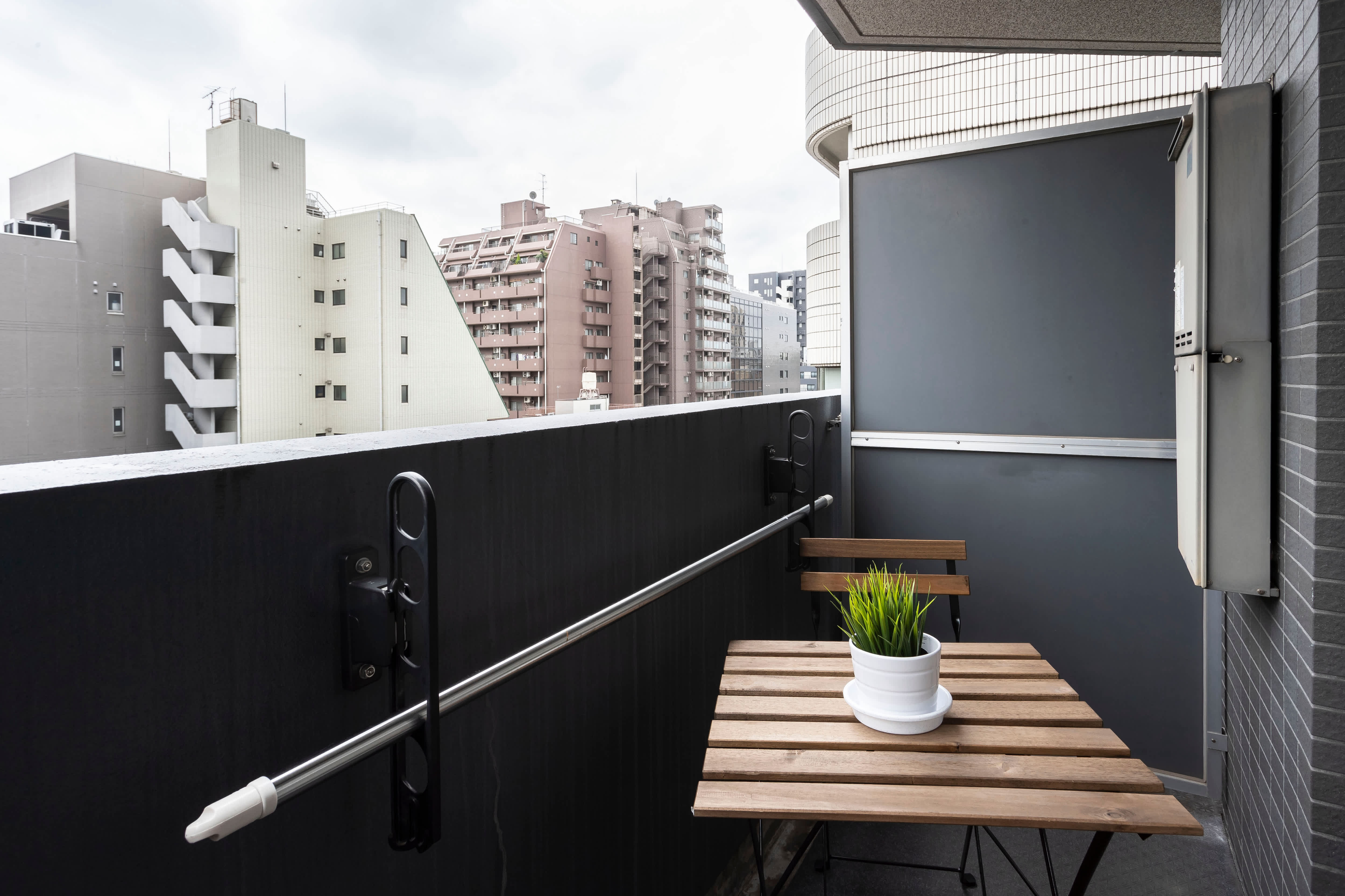 Small balcony with privacy screen over railing