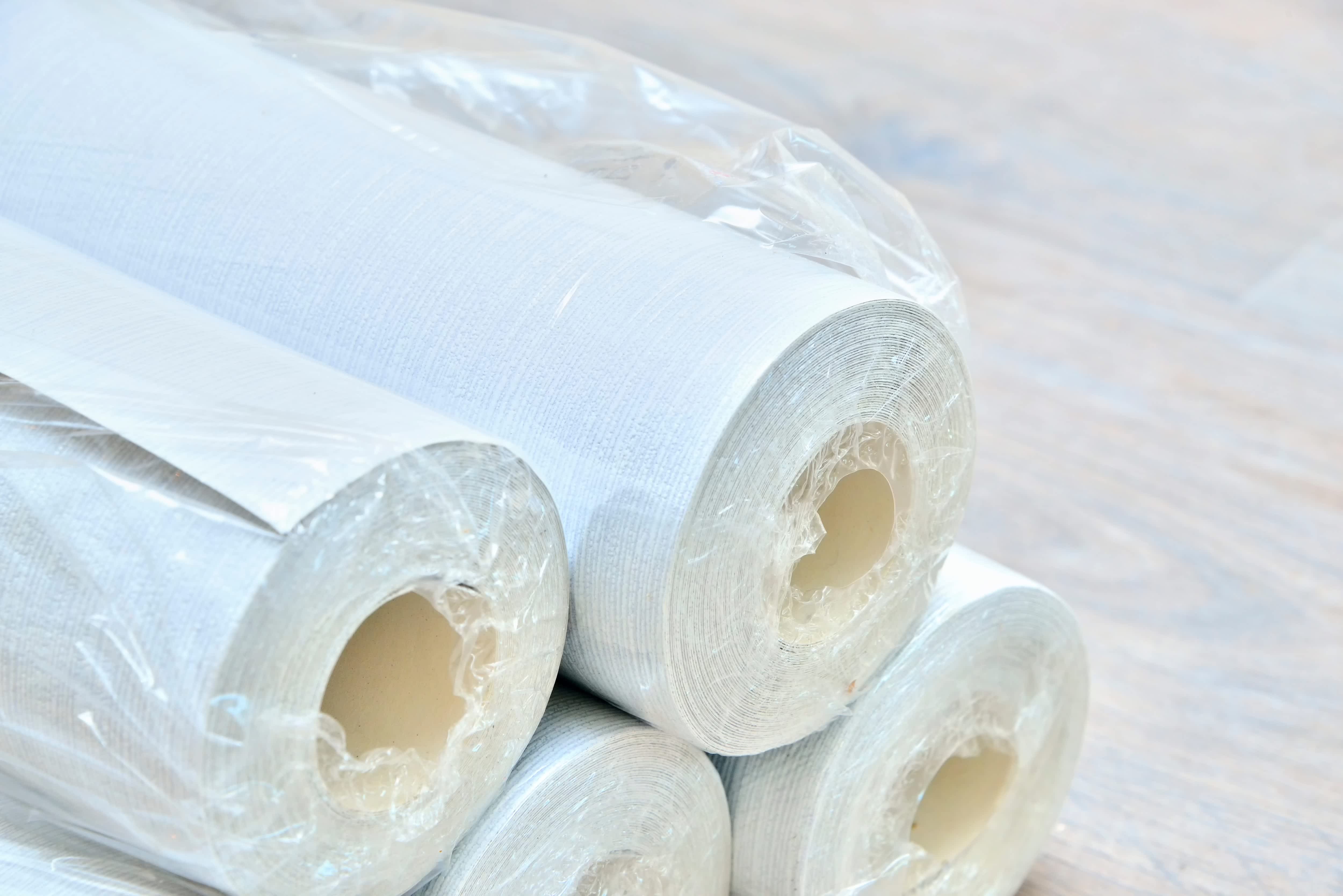 Rolls of wallpaper ready to be installed