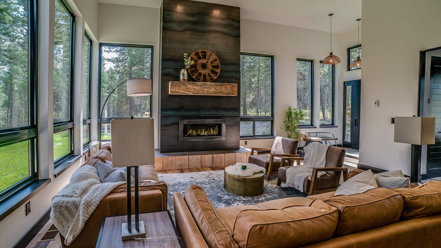 A trendy living room with wraparound windows