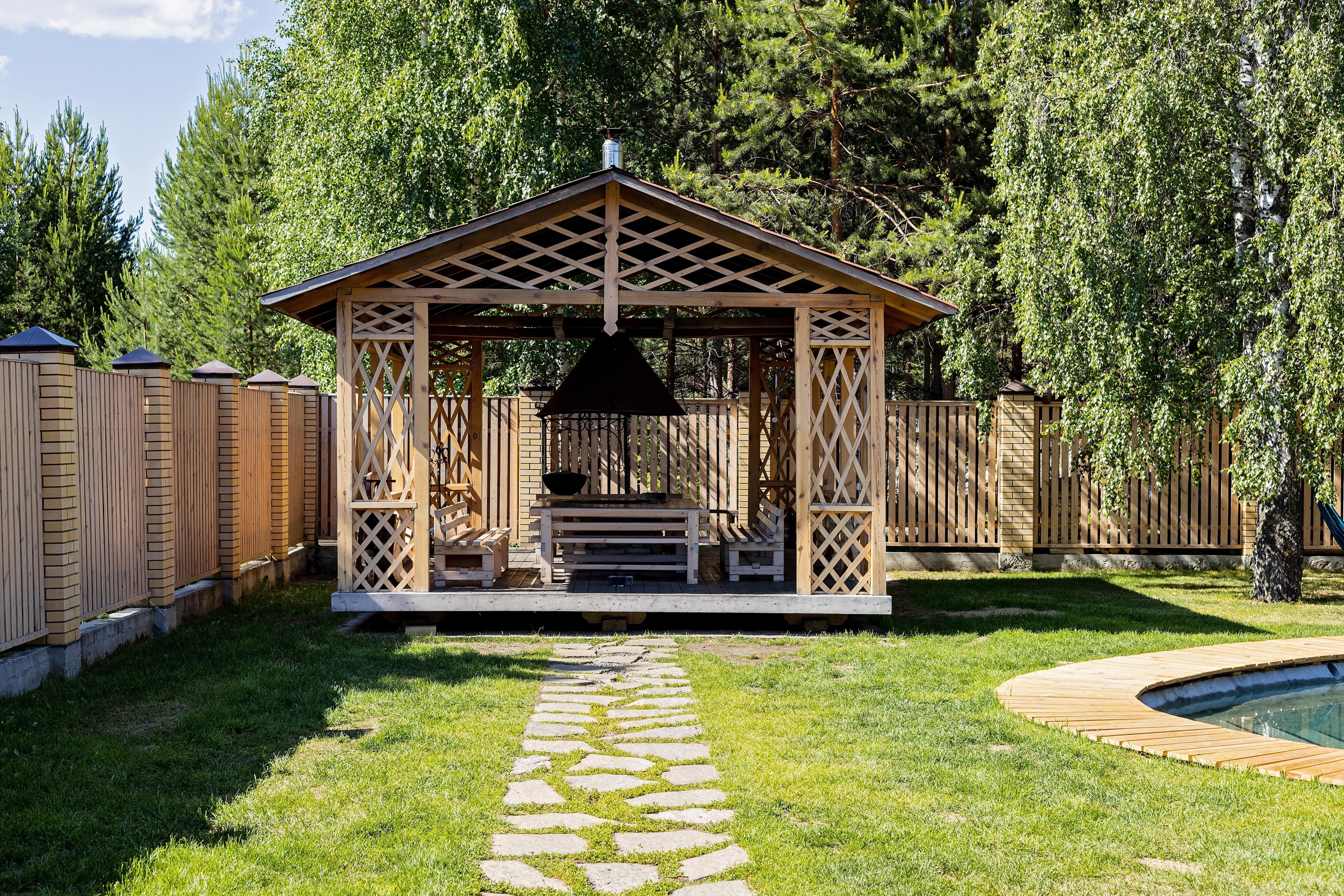 Wooden gazebo with dining table