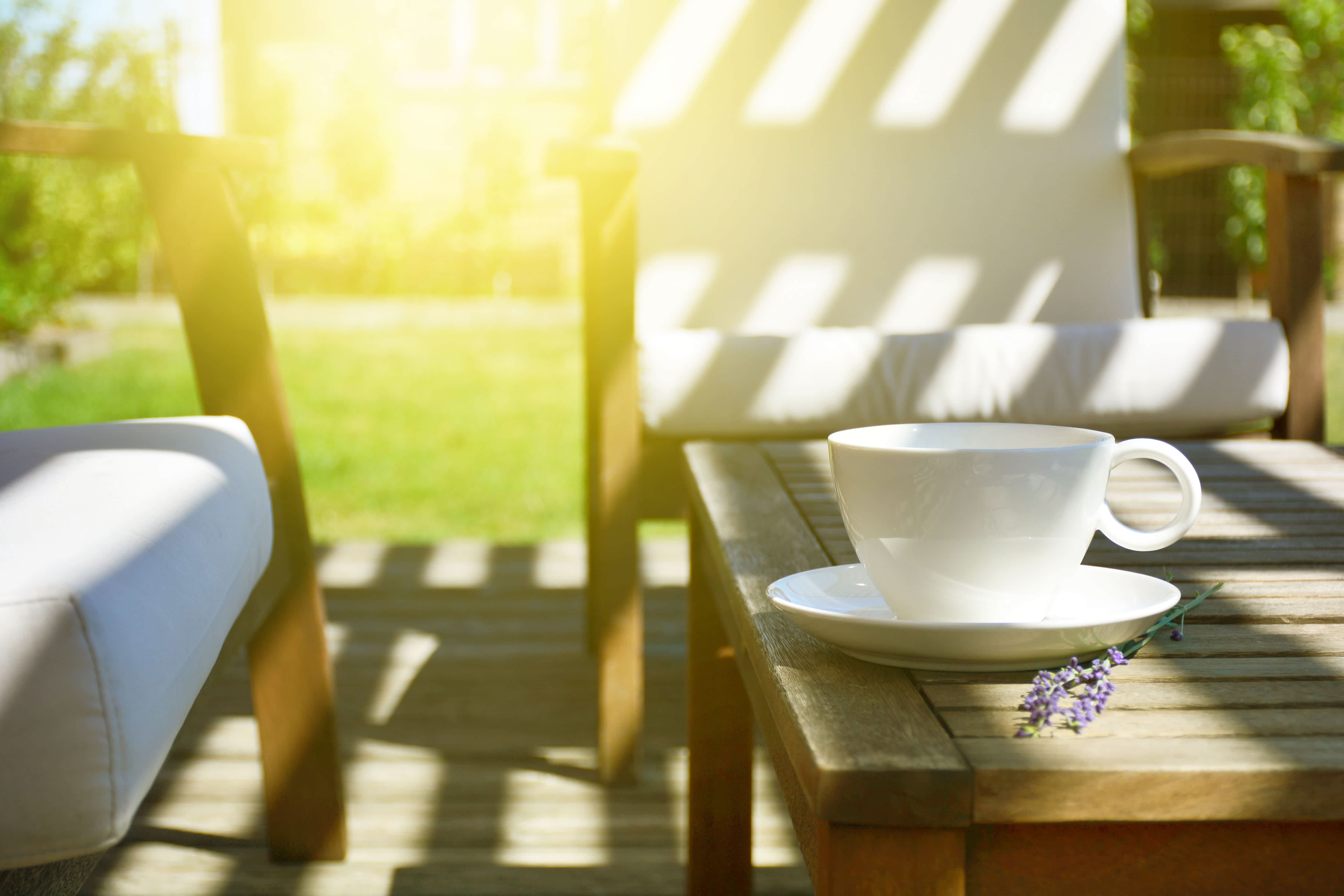 Wooden coffee table with coffee mug on top