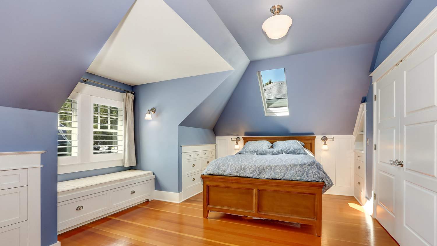 Attic bedroom with vaulted ceilings painted lavender