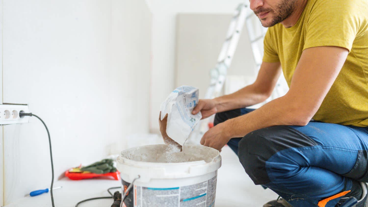 Man mixing the drywall mud