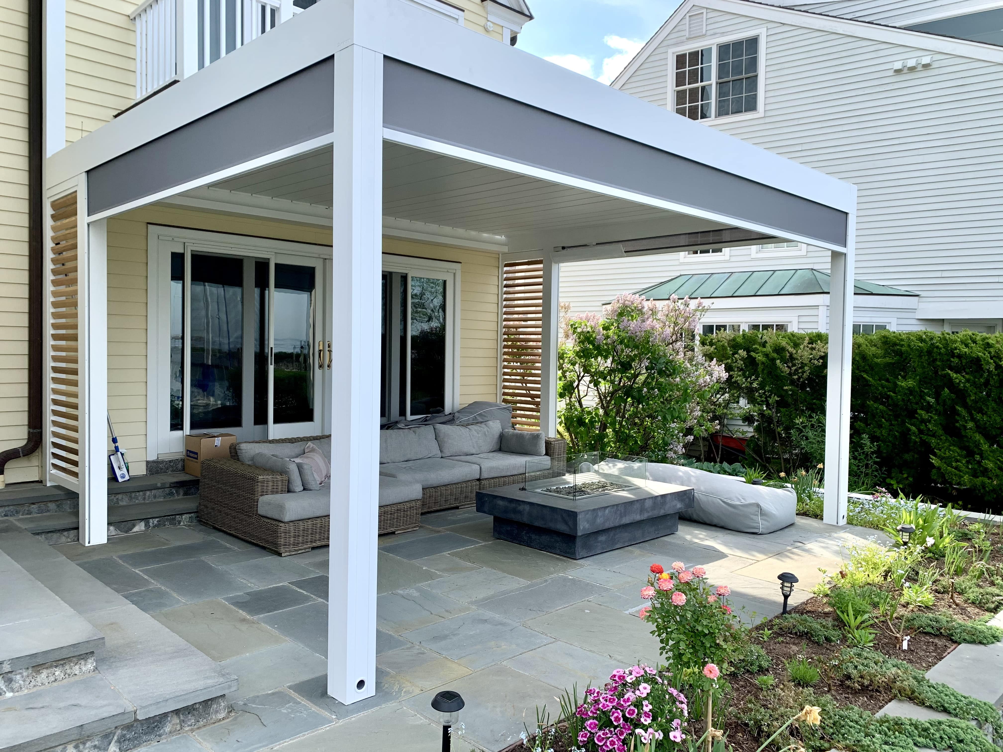 Outdoor sectional and bean bag chair around gas fire pit