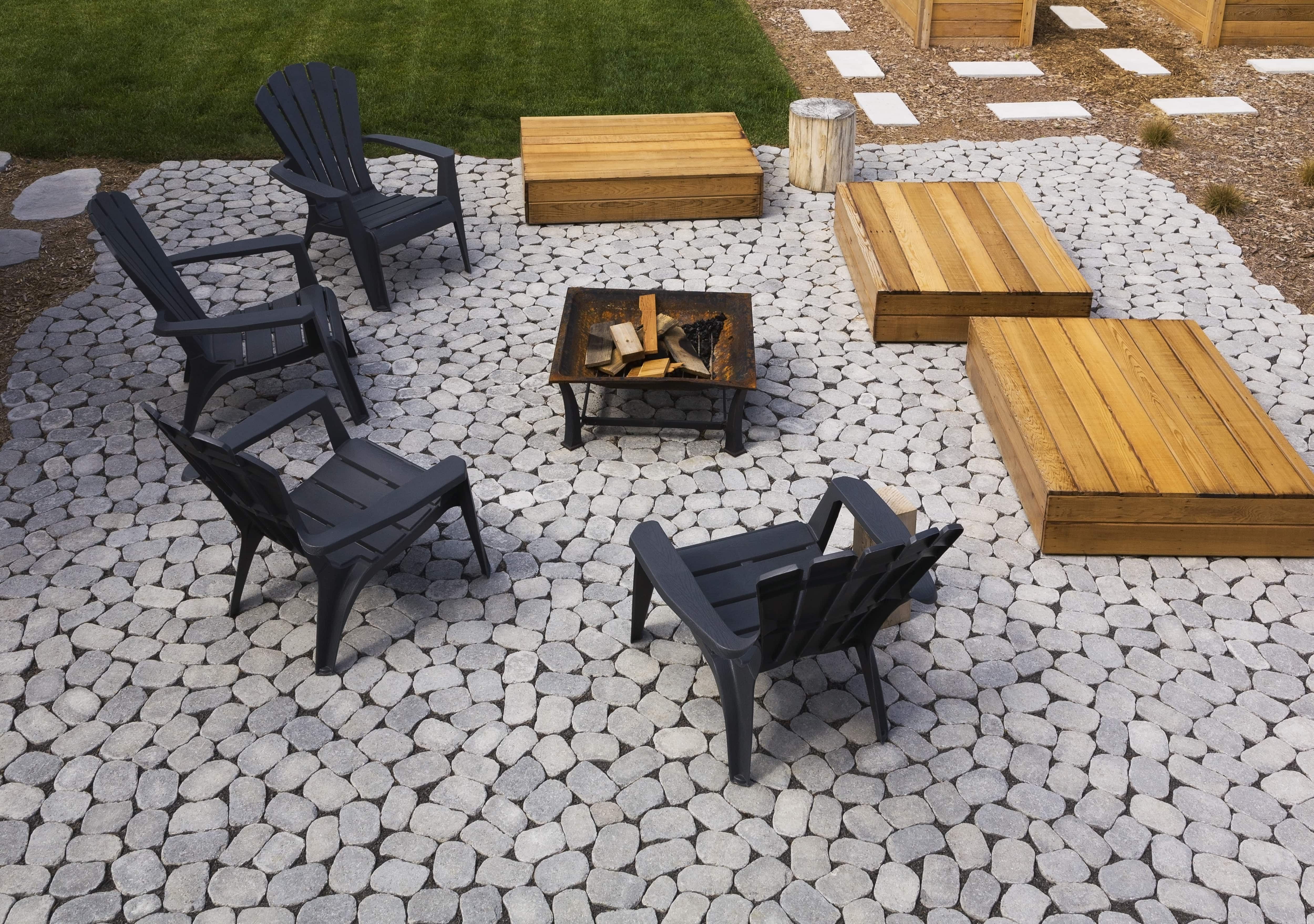 Black Adirondack chairs and raised platform fire pit seating