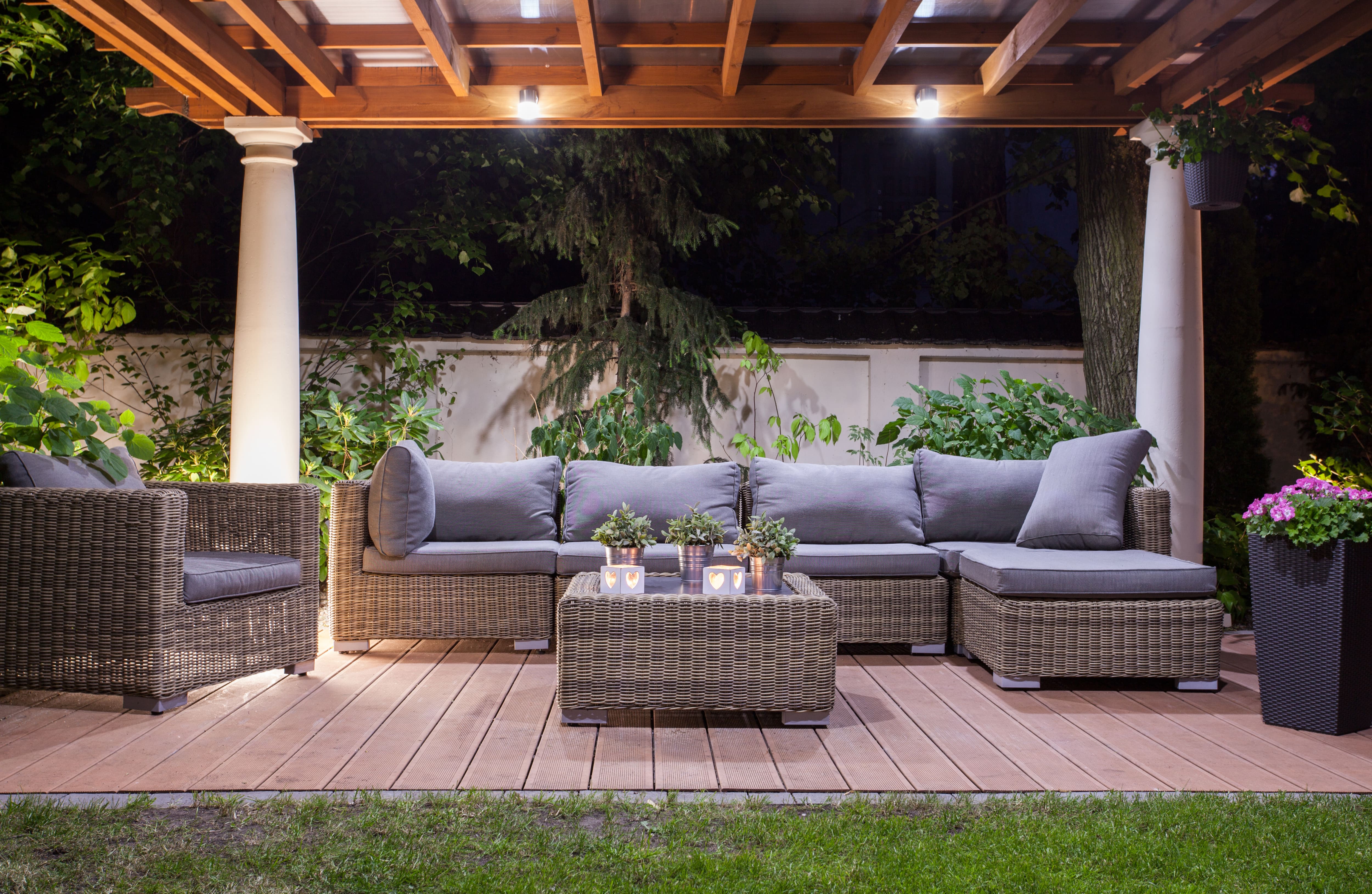 An outdoor freestanding patio with a living room setup