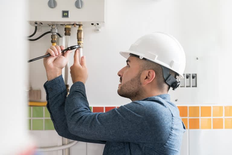 Man draining water heater