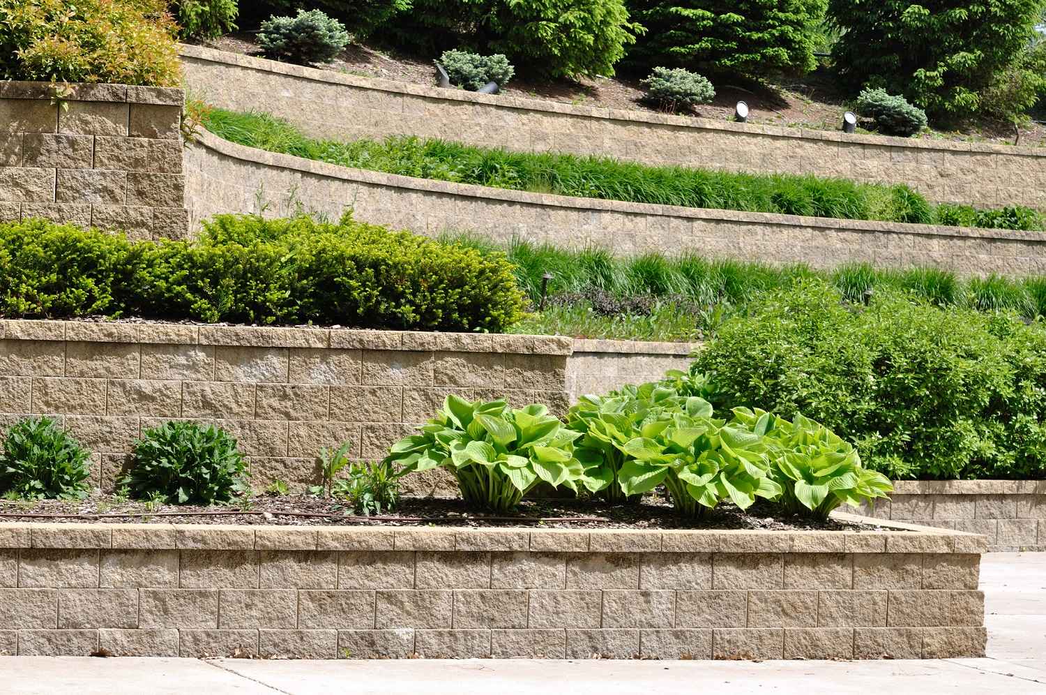 A tiered retaining wall in a house’s garden