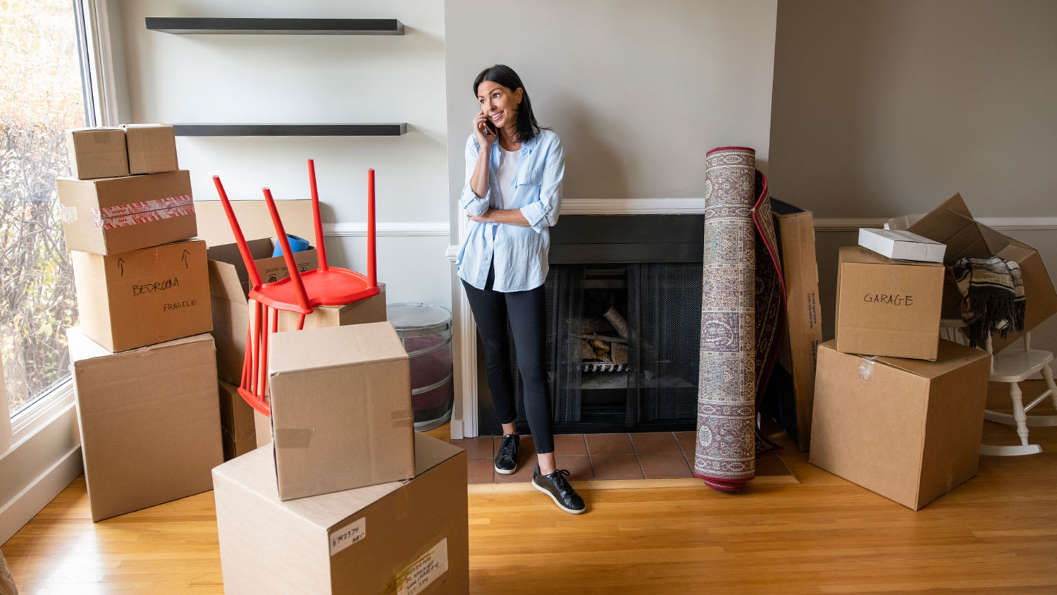 woman on the phone moving into new home