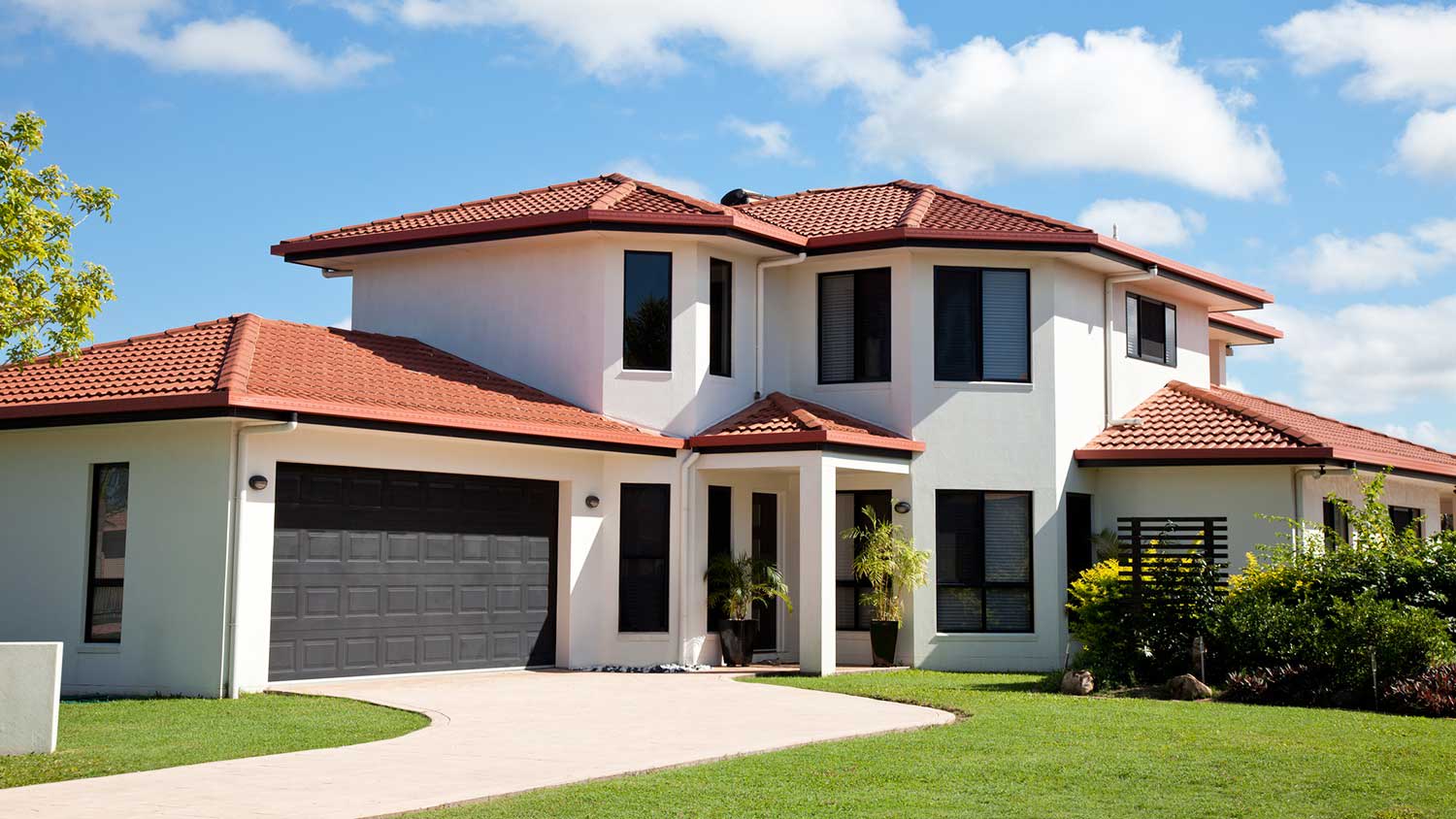 Large new house with red roof shingles