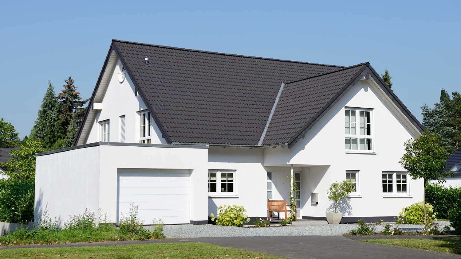 New house with black roof and one car garage