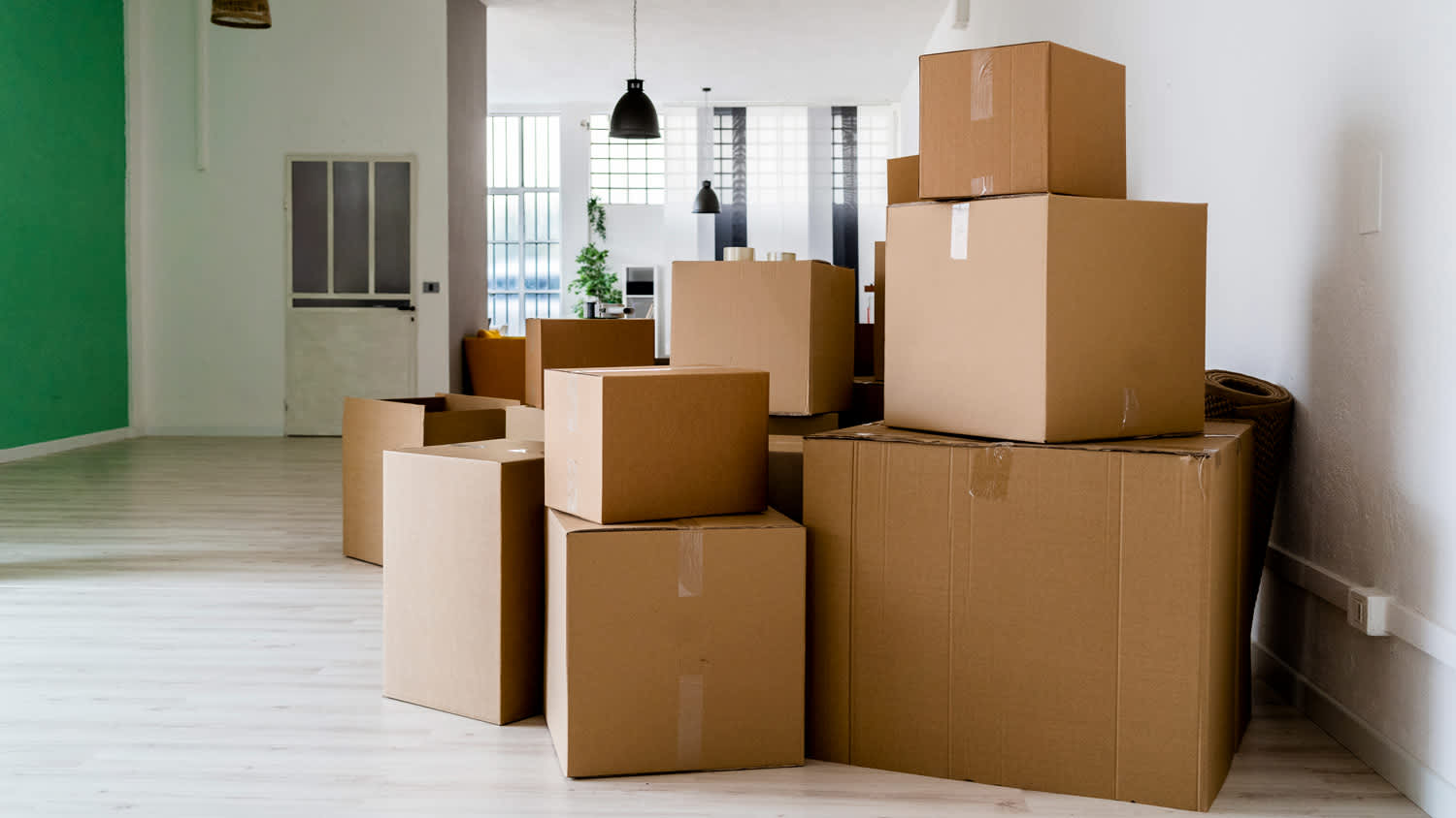 A pile of boxes in an empty house