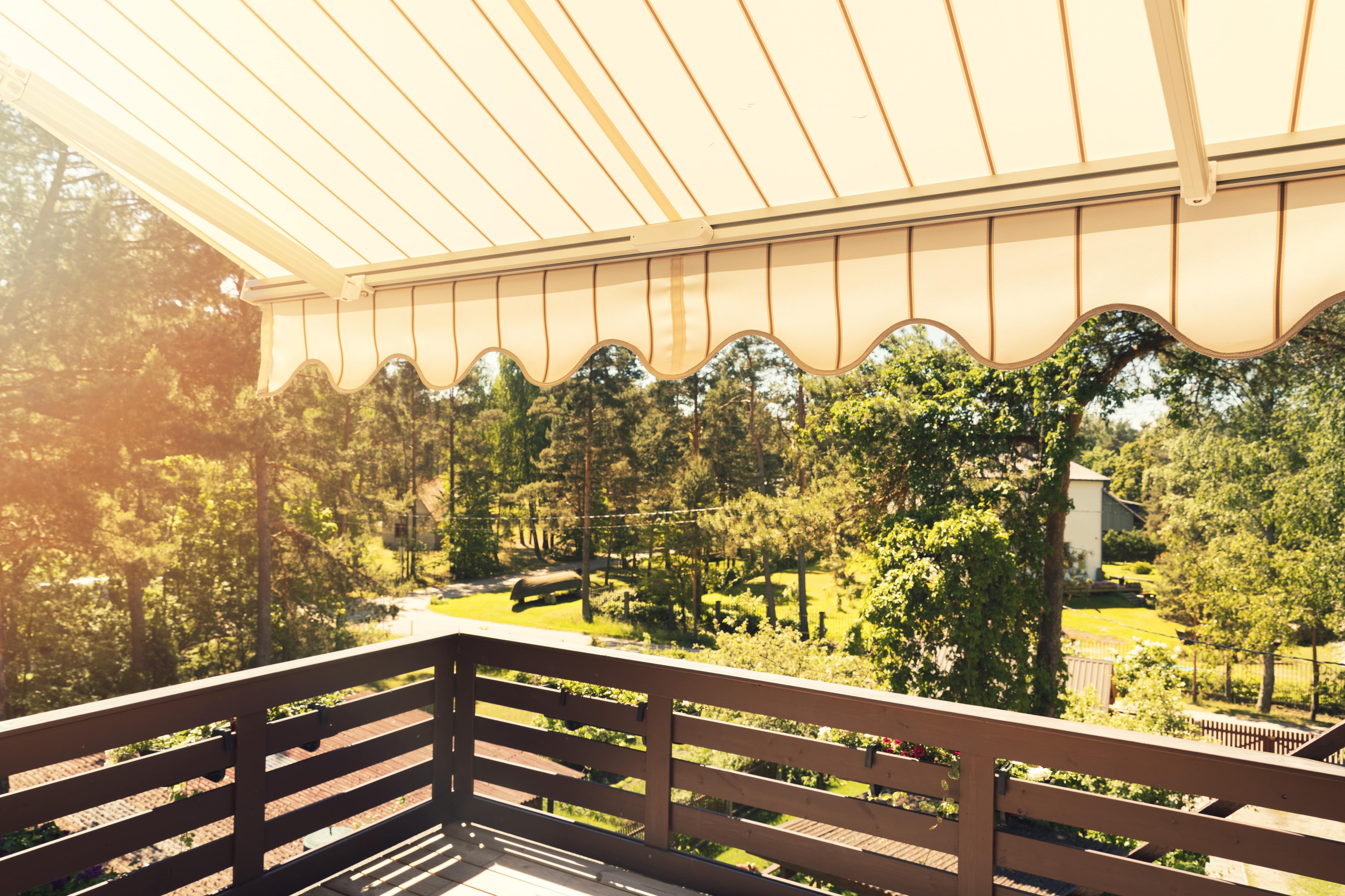 A brown and yellow retractable awning