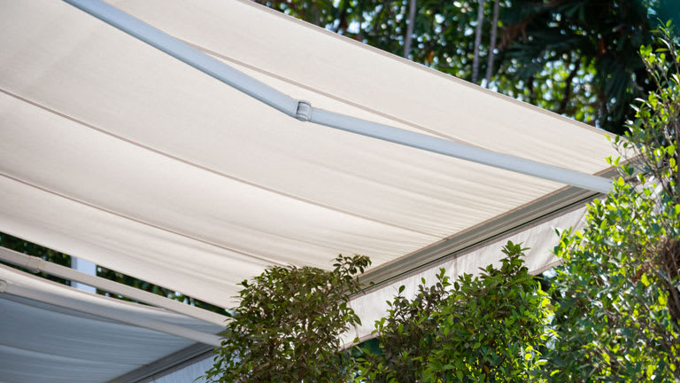 white awning in garden, canvas shading