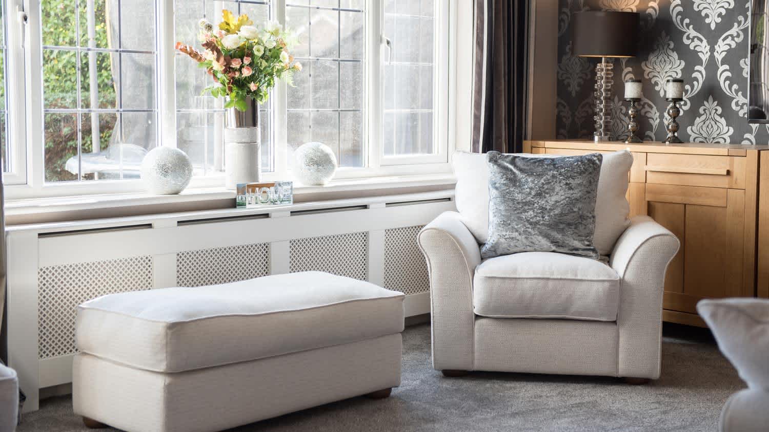 The interior of a carpeted living room lounge