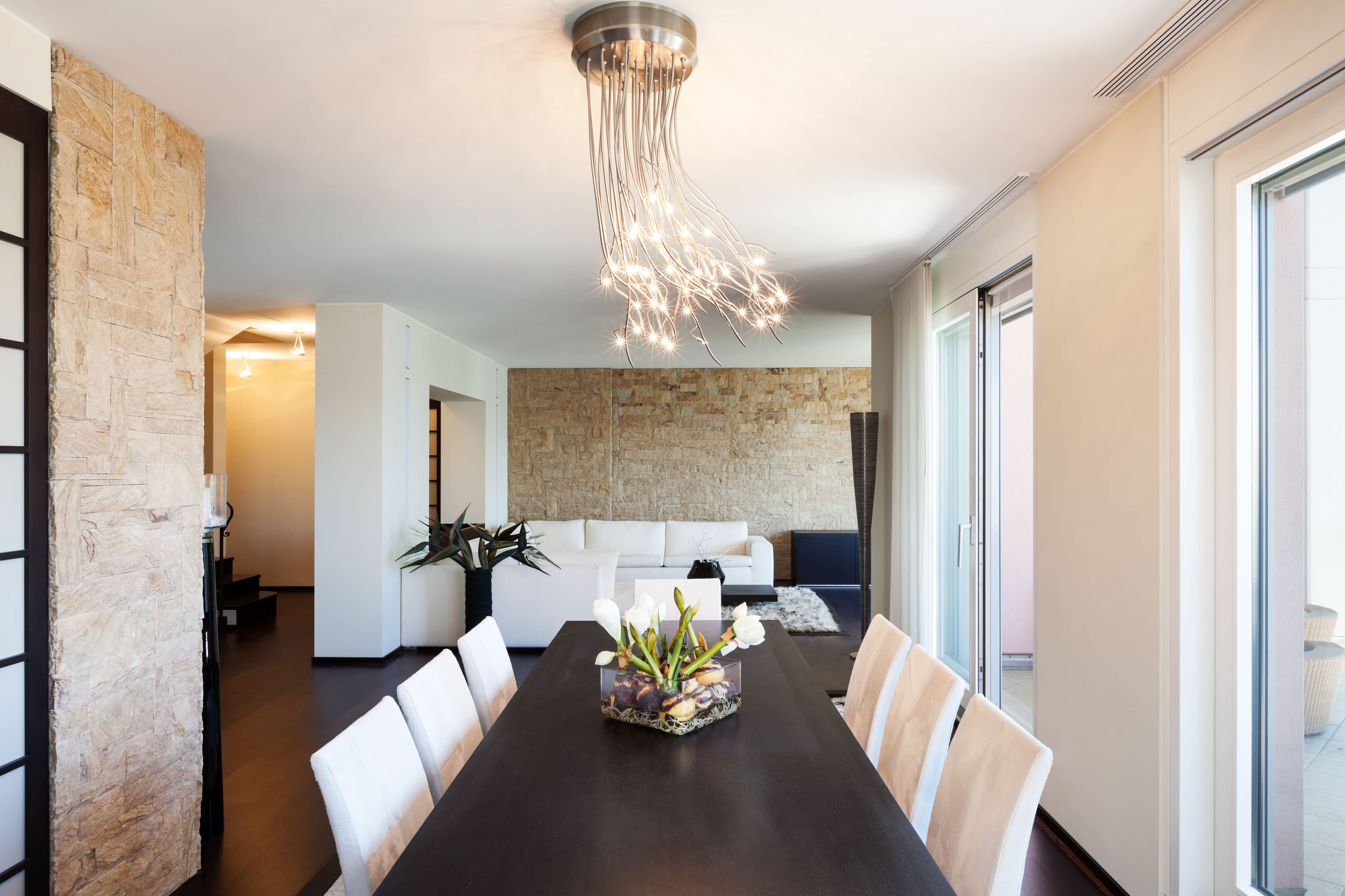 A flush mount chandelier with metal strands and LED lights