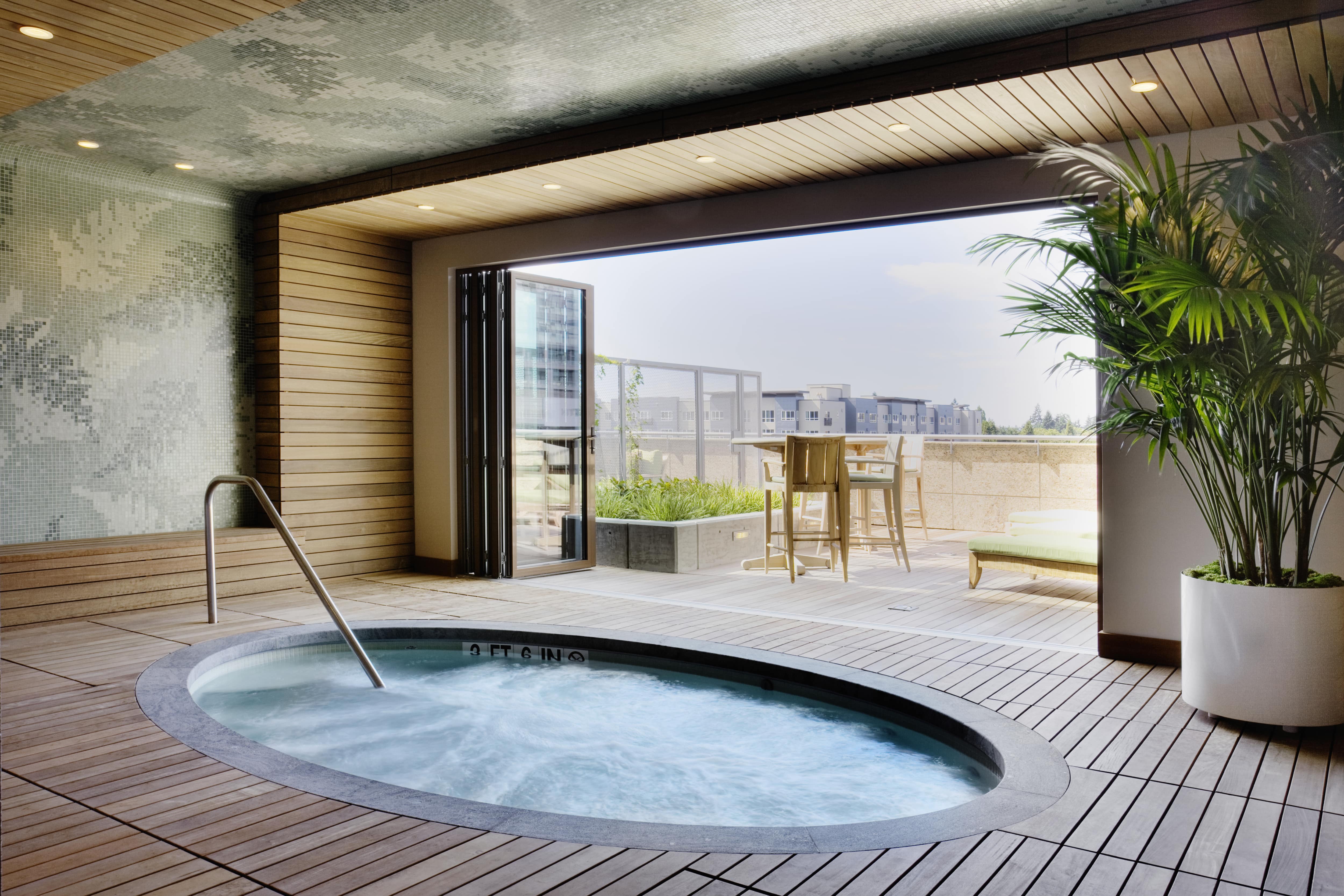 An indoor, in-ground hot tub