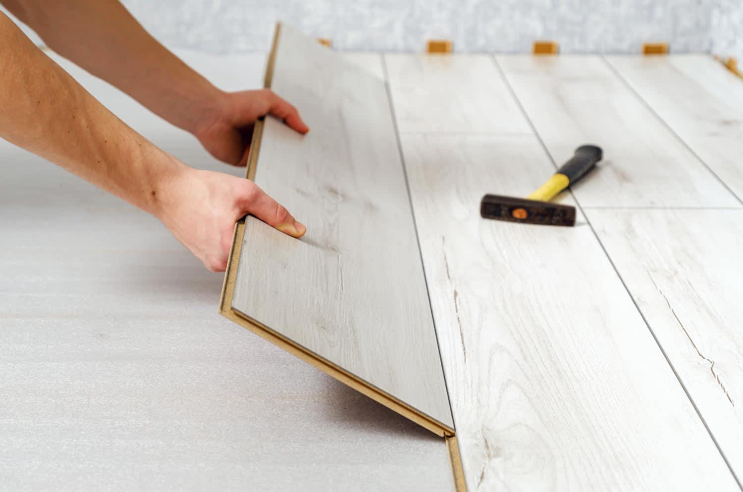 A close up of a wooden panel of laminate floor indoors