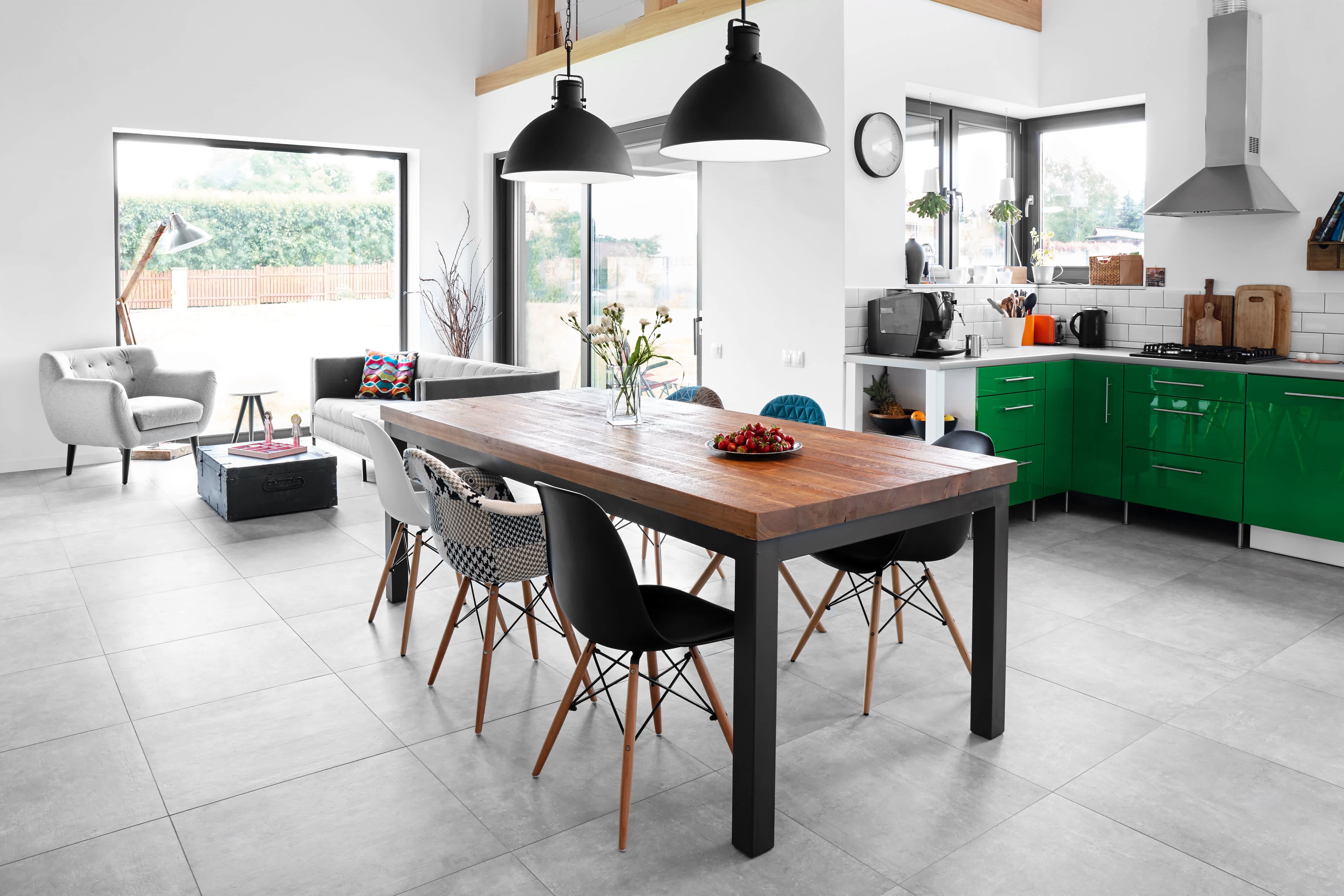 Modern dining room with dining table and black industrial pendant lights