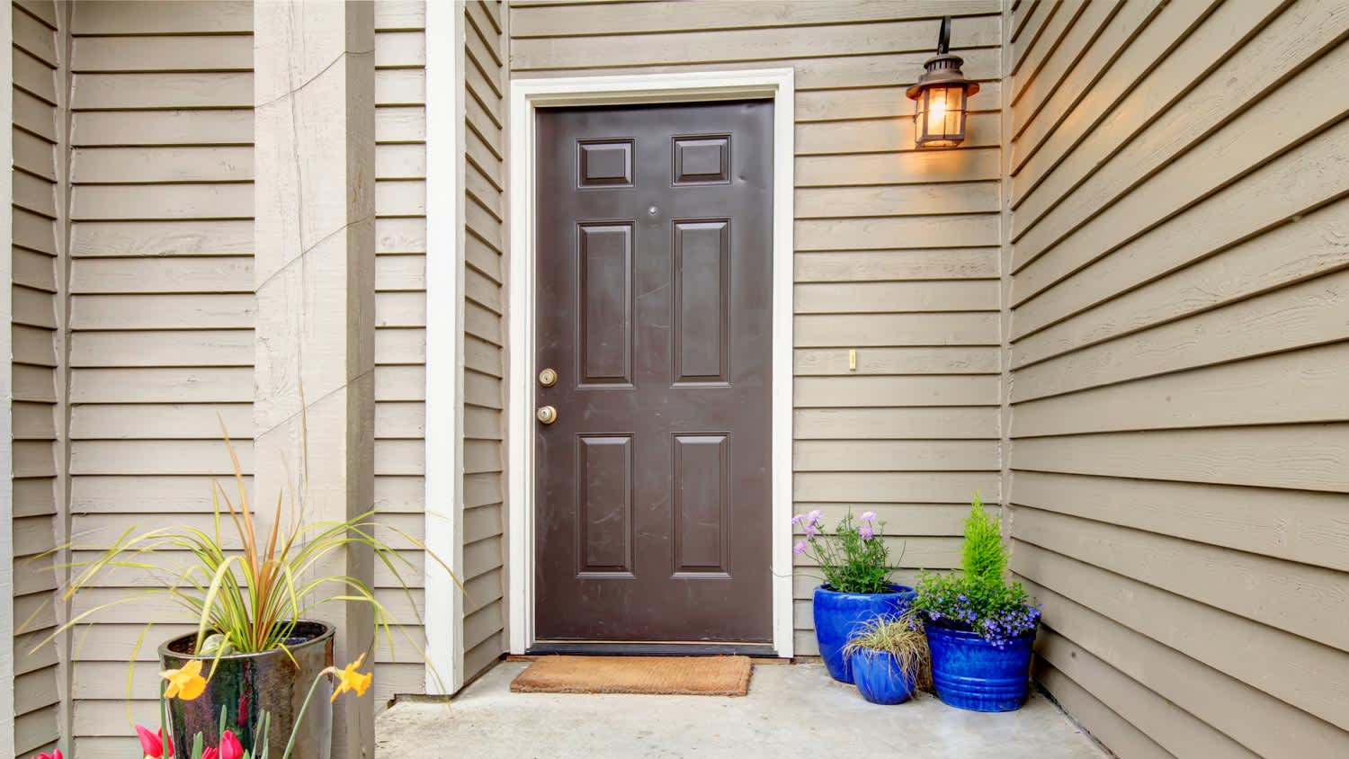 A house entrance with fiber cement siding