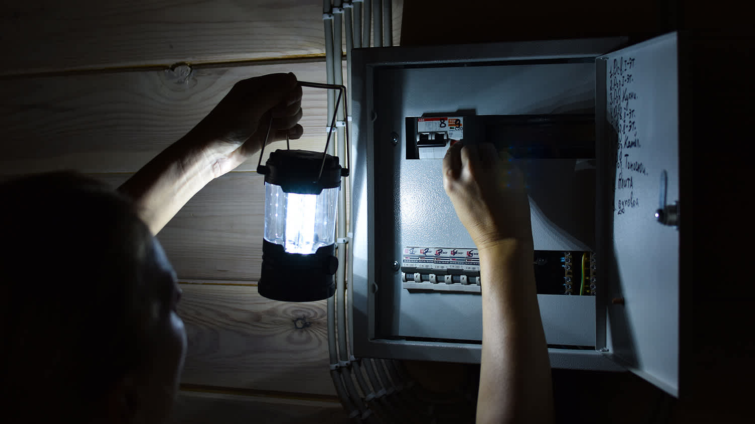 Looking at an electrical panel with flashlight
