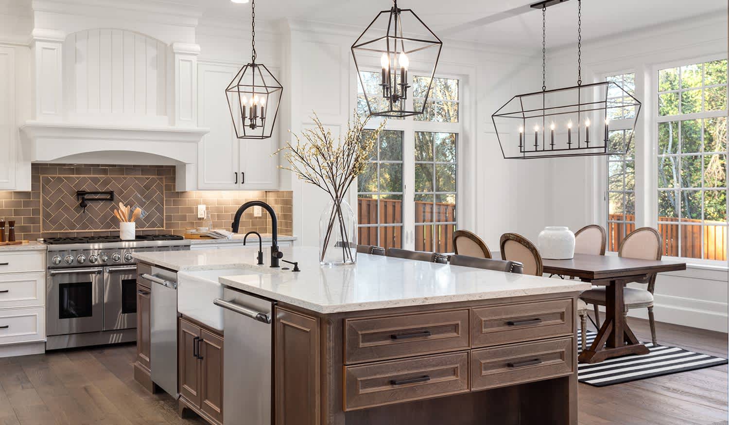 Luxurious kitchen and dining space with modern chandelier lighting