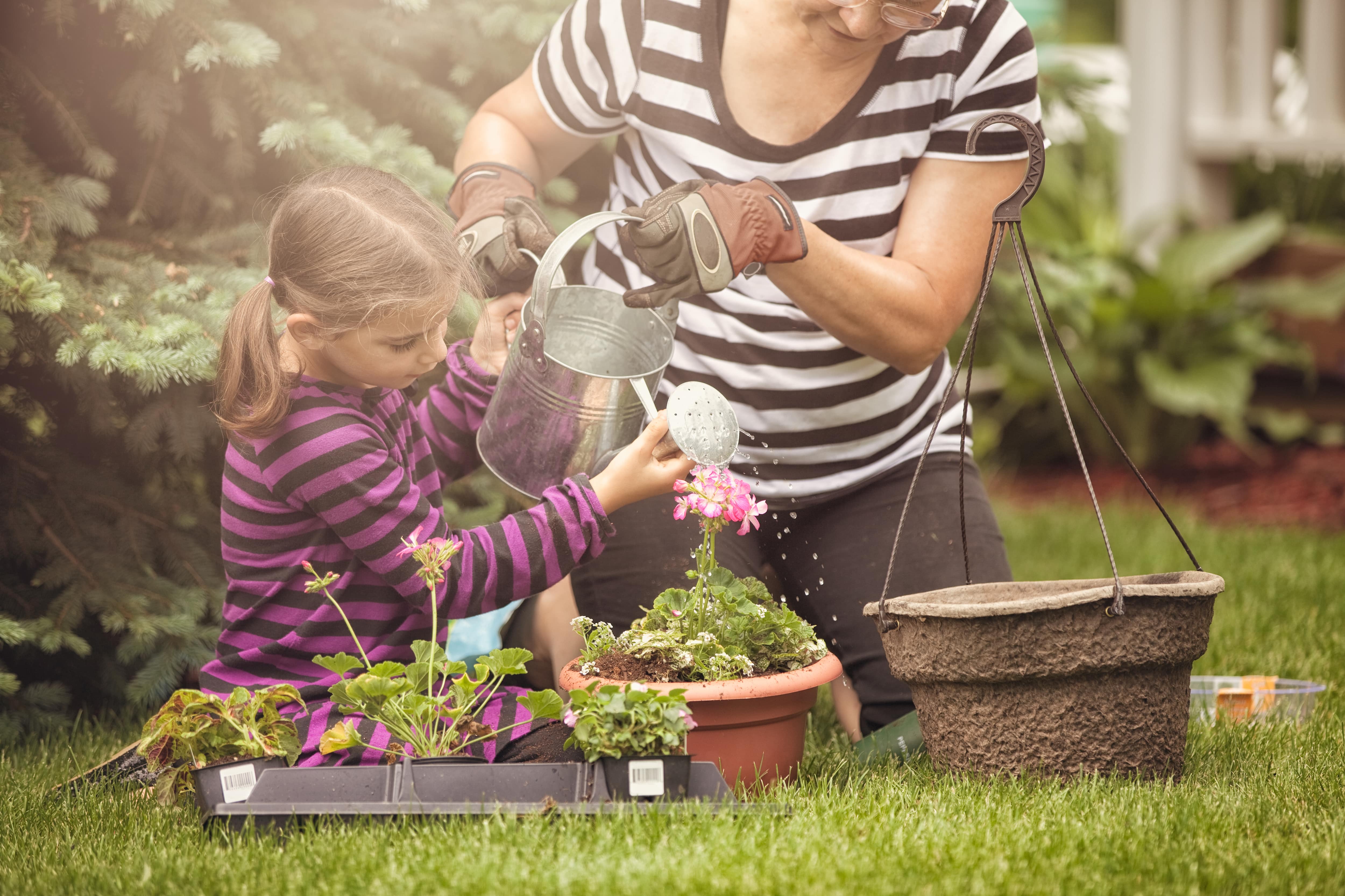 Woman and child gardening together