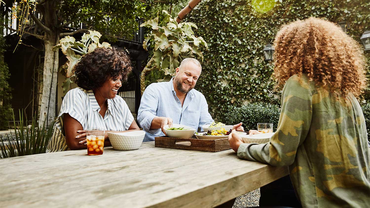 A family sits at a picnic table
