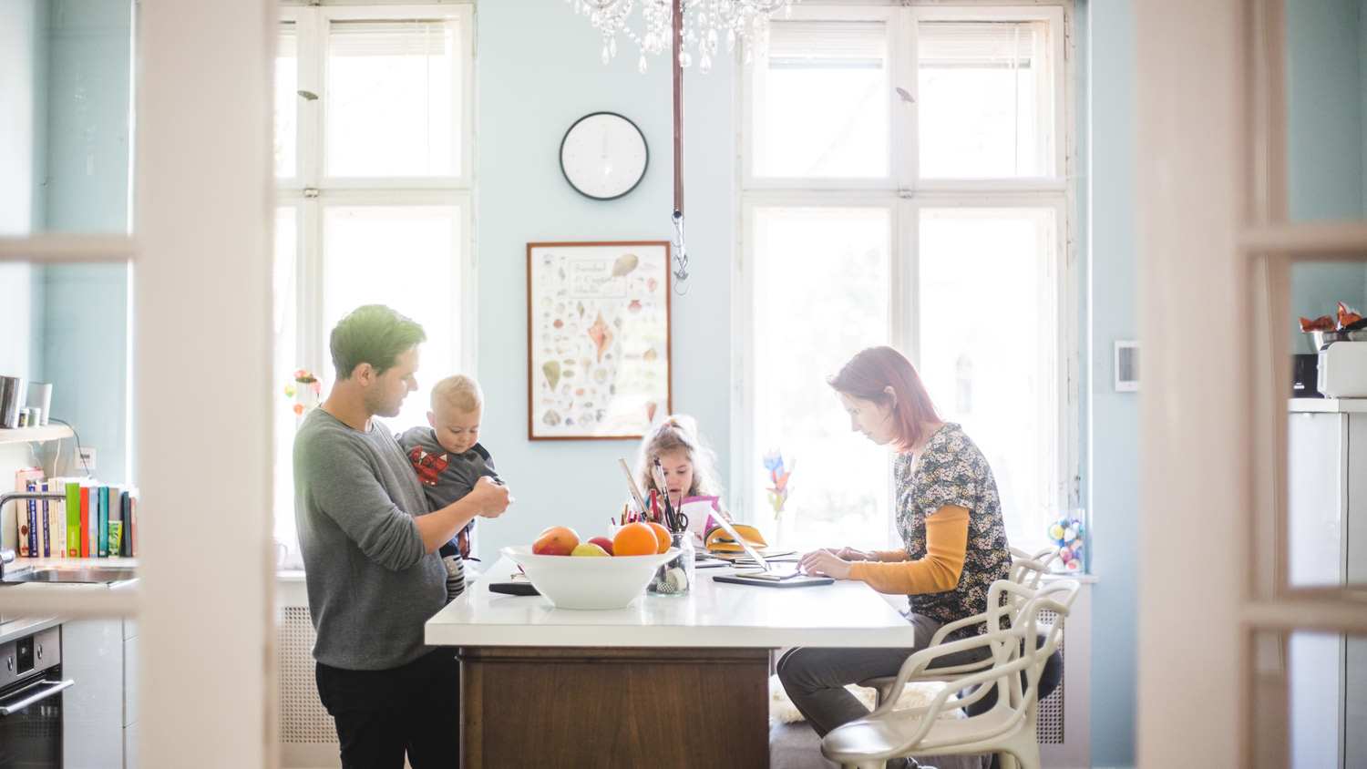 A family spending quality time in their bright kitchen