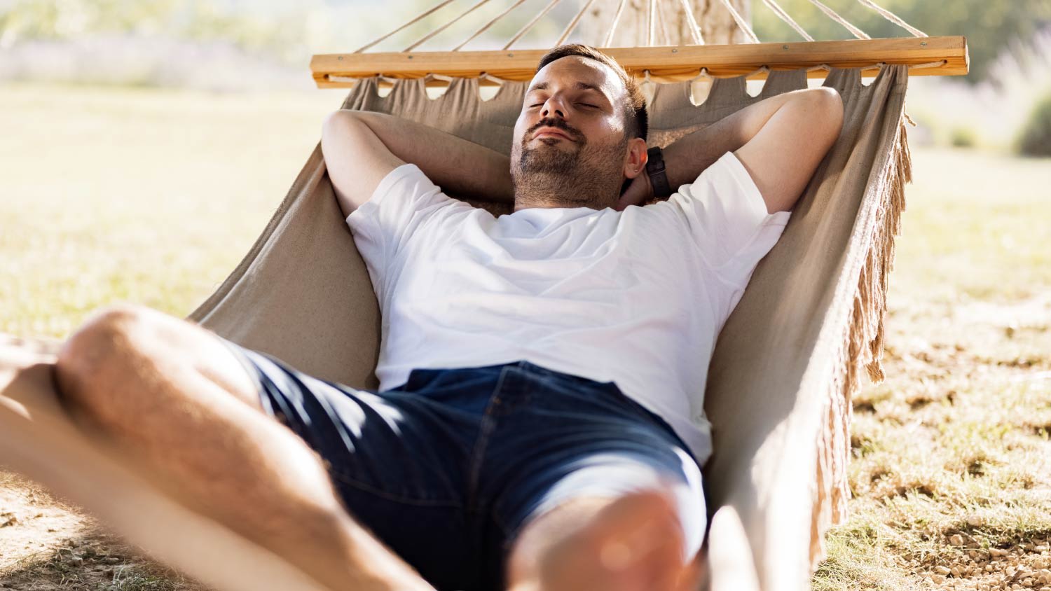 man relaxing on a hammock