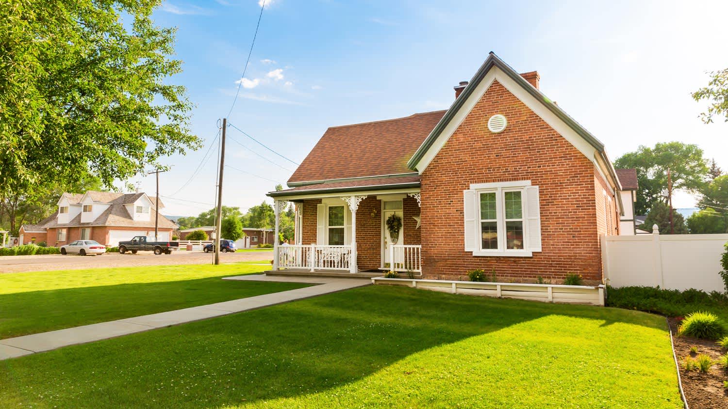 A small brick house on a sunny day