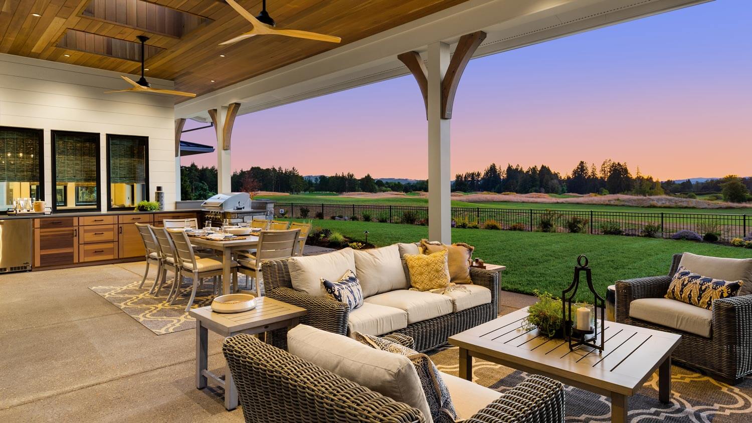 A luxury outdoor kitchen with a ceiling fan