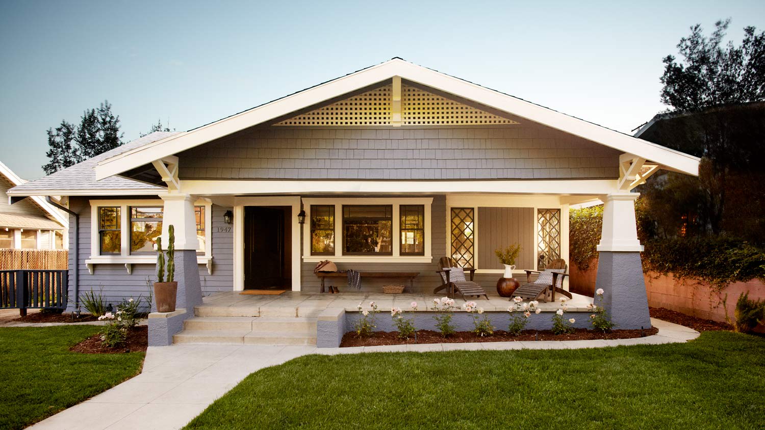 The exterior of a craftsman house at sunset