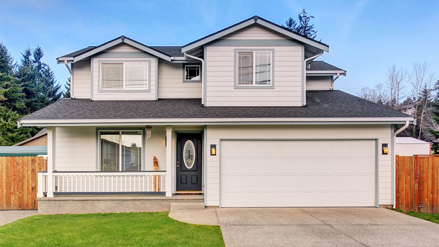 beige home with single driveway