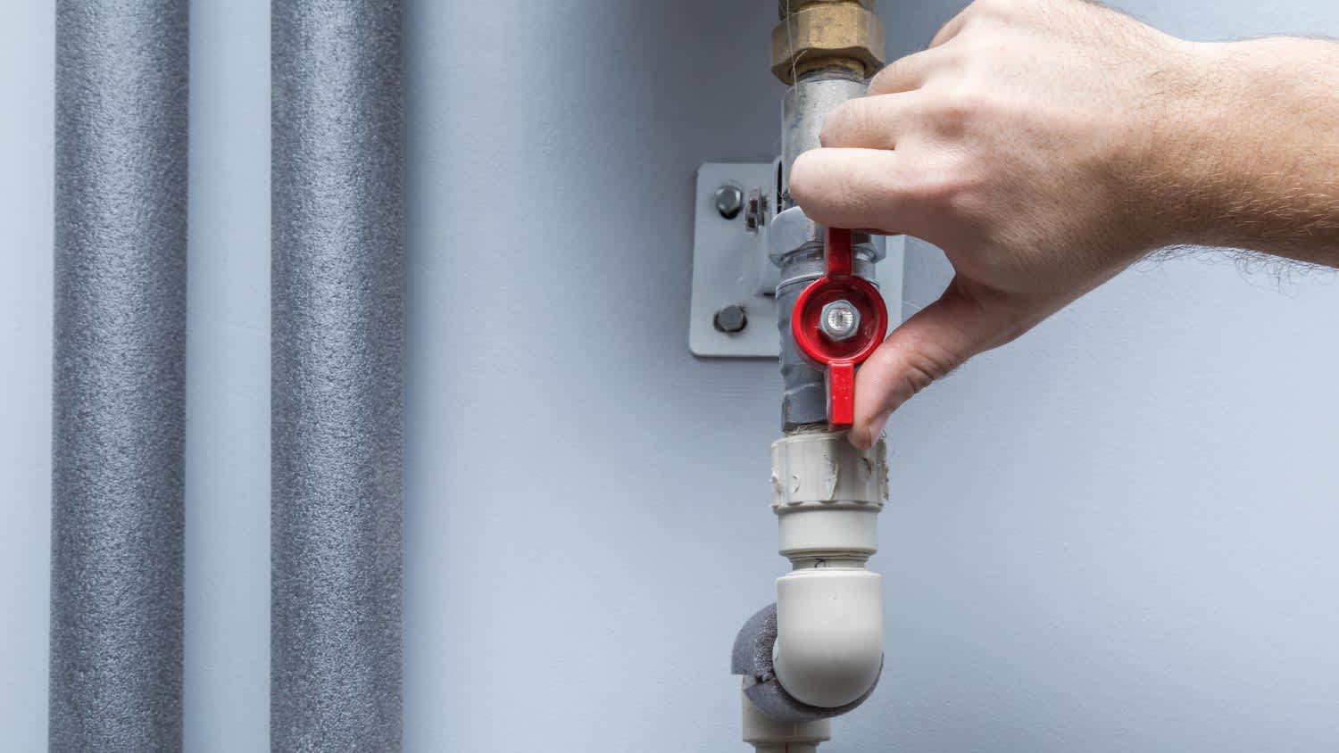 A man turning off water supply