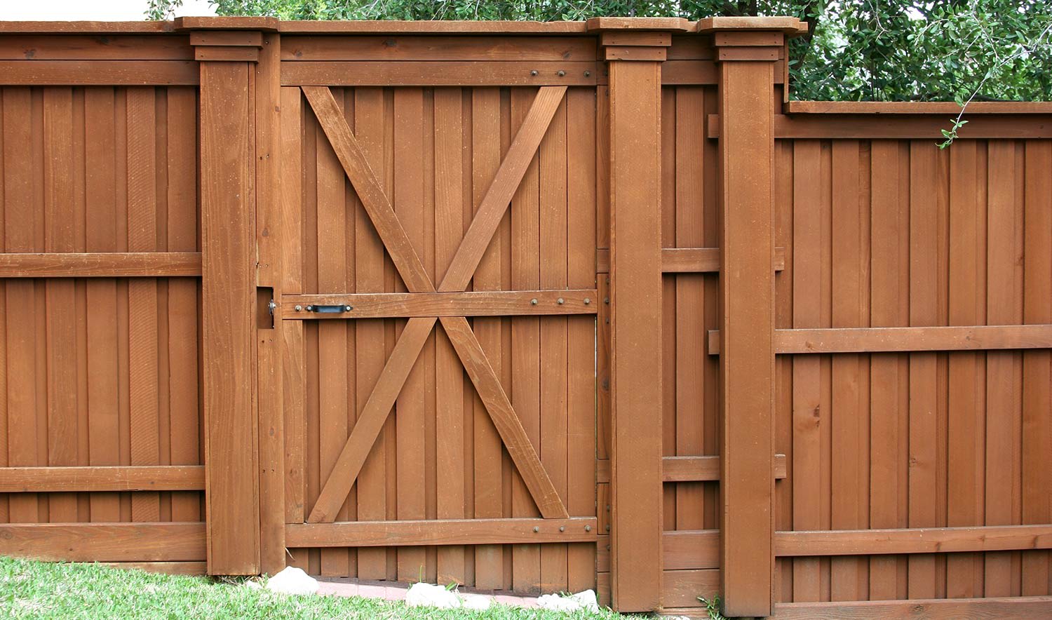 Gate in a stained cedar privacy fence