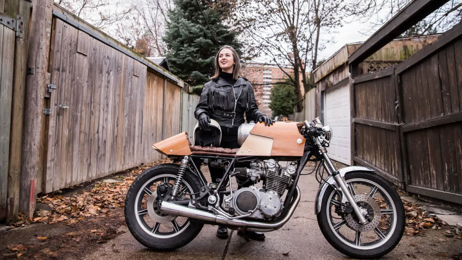 A woman with her motorcycle