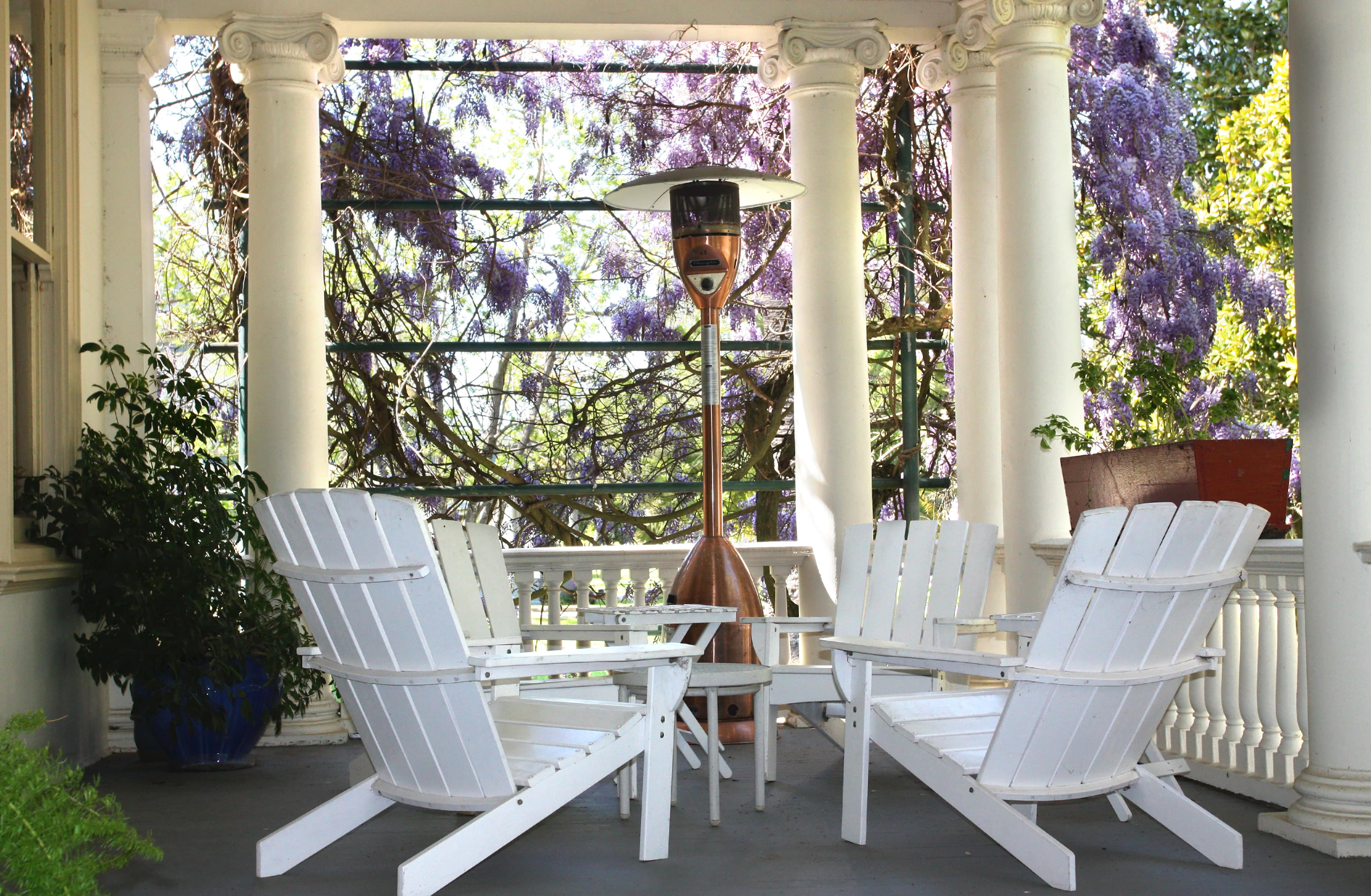 Outdoor chairs next to portable space heater