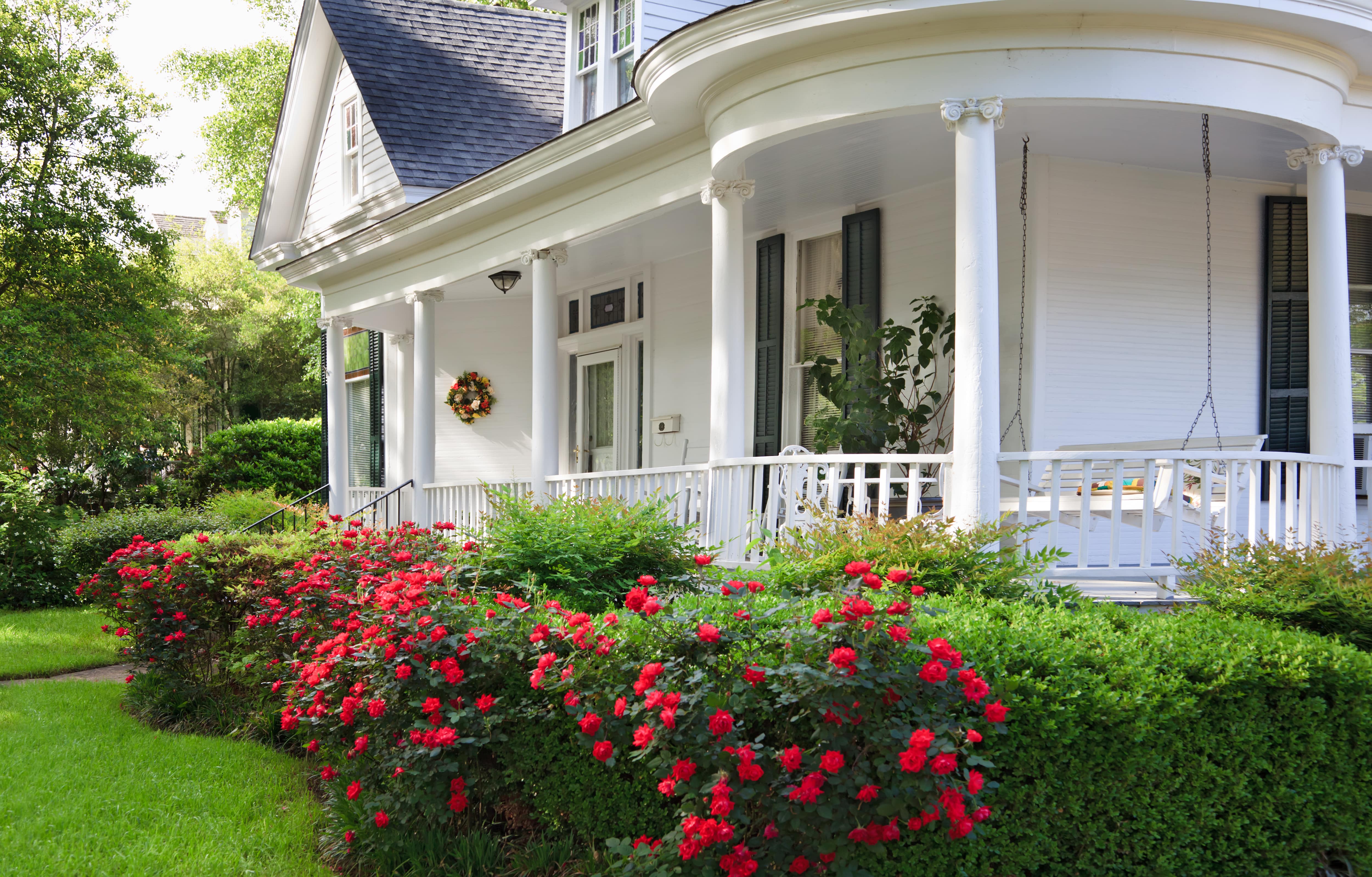 Wraparound porch in front of stately home