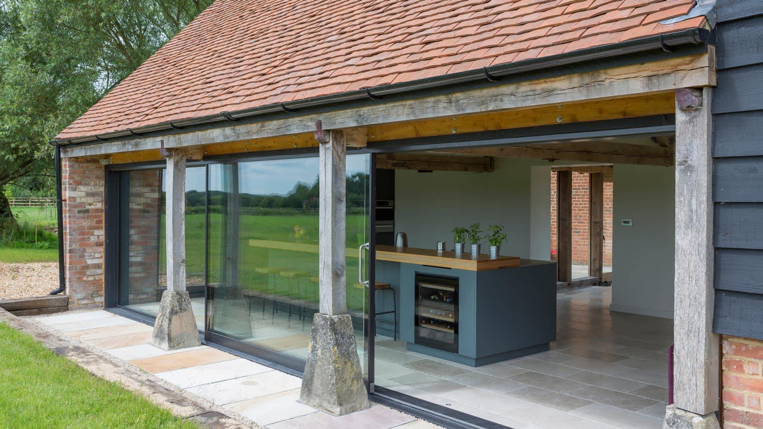 Glass sliding doors of a renovated barn home