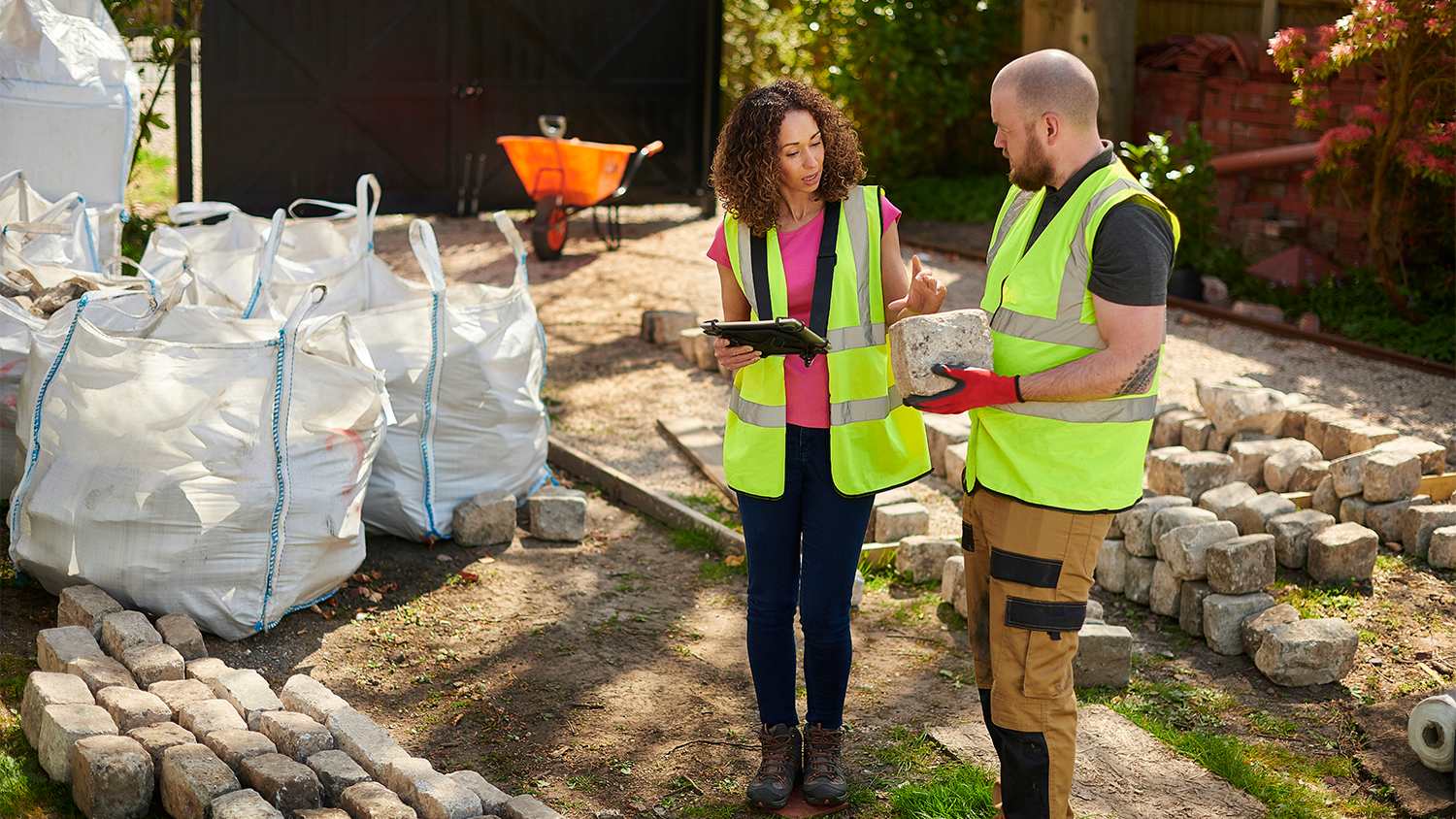 landscape designer and contractor going over project
