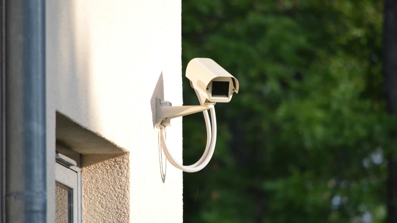 A security camera on the exterior of a house