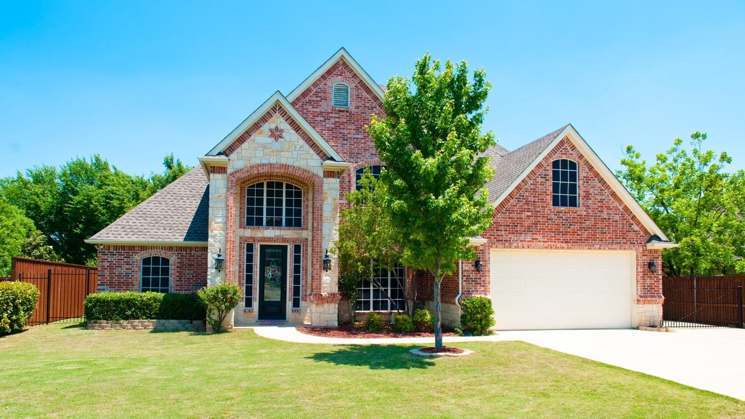 A two story brick residential house
